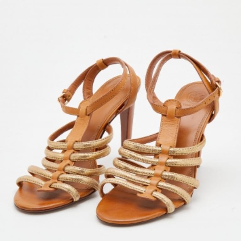 These Tory Burch sandals will luxuriously frame your feet. Created from leather, they are equipped with a strappy upper, an ankle buckle closure, and 11cm heels.