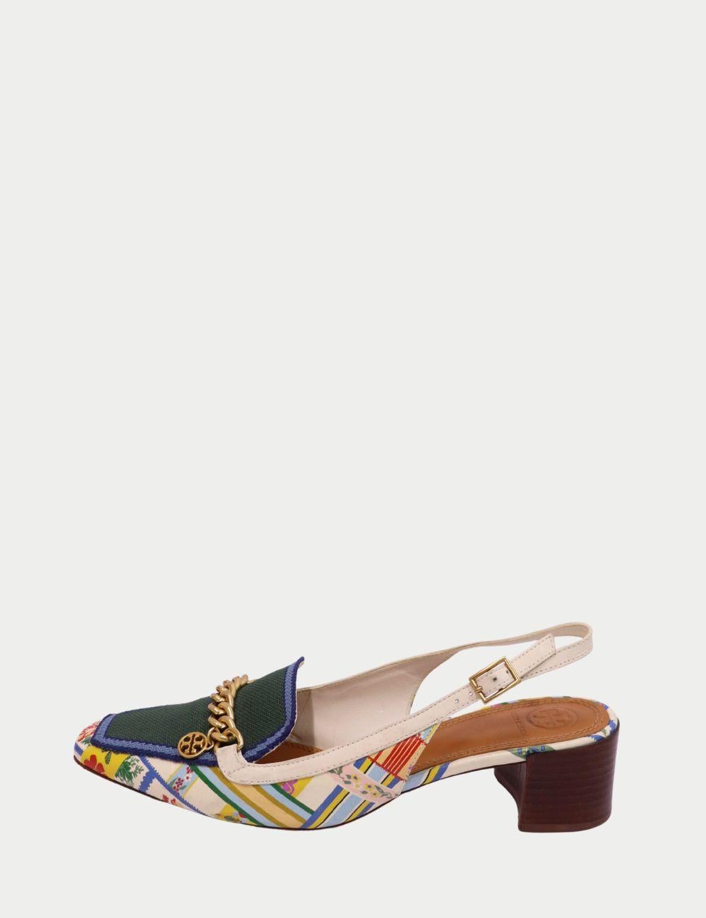 Tory Burch - Mocassins à talon imprimé avec chaîne en or 

Adoptez un style remarquable avec ces mocassins à talon aiguille imprimés de Tory Burch, où les couleurs audacieuses s'allient à une sophistication sans effort. Conçus avec un riche mélange