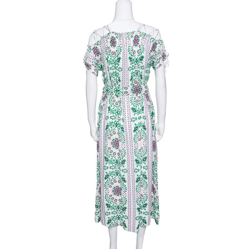 Tailored from silk, this Tory Burch dress has floral prints all over, short sleeves and a tie at the waist which gives the dress a stunning silhouette. This dress can be assembled with beige sandals and a Cartier Love bracelet for an elegant