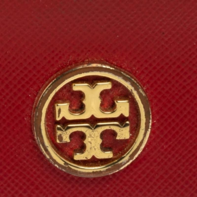 Now here is one piece that definitely stands out! This Tory Burch cardholder comes crafted from red leather and flaunts a gold-tone brand logo on the front. It houses multiple card slots and opens to a leather and fabric compartment. It will help