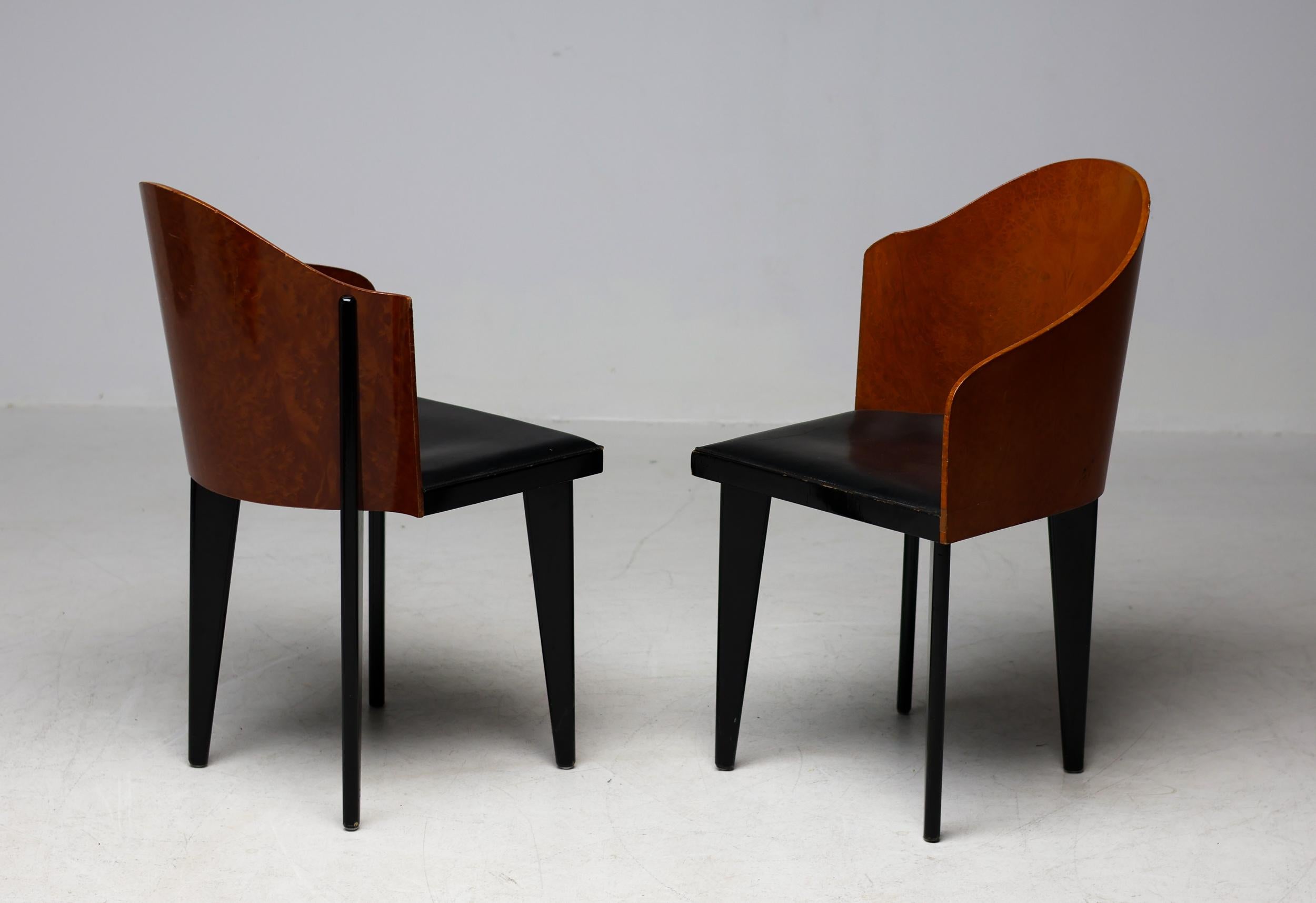 A nice pair of asymmetrical Toscana chairs designed in 1986 by Piero Sartogo for Saporiti .
These chairs were designed in 1986 by Piero Sartogo and Nathalie Grenon for Saporiti Italia. 
They feature a curved burl veneer back creating a beautiful