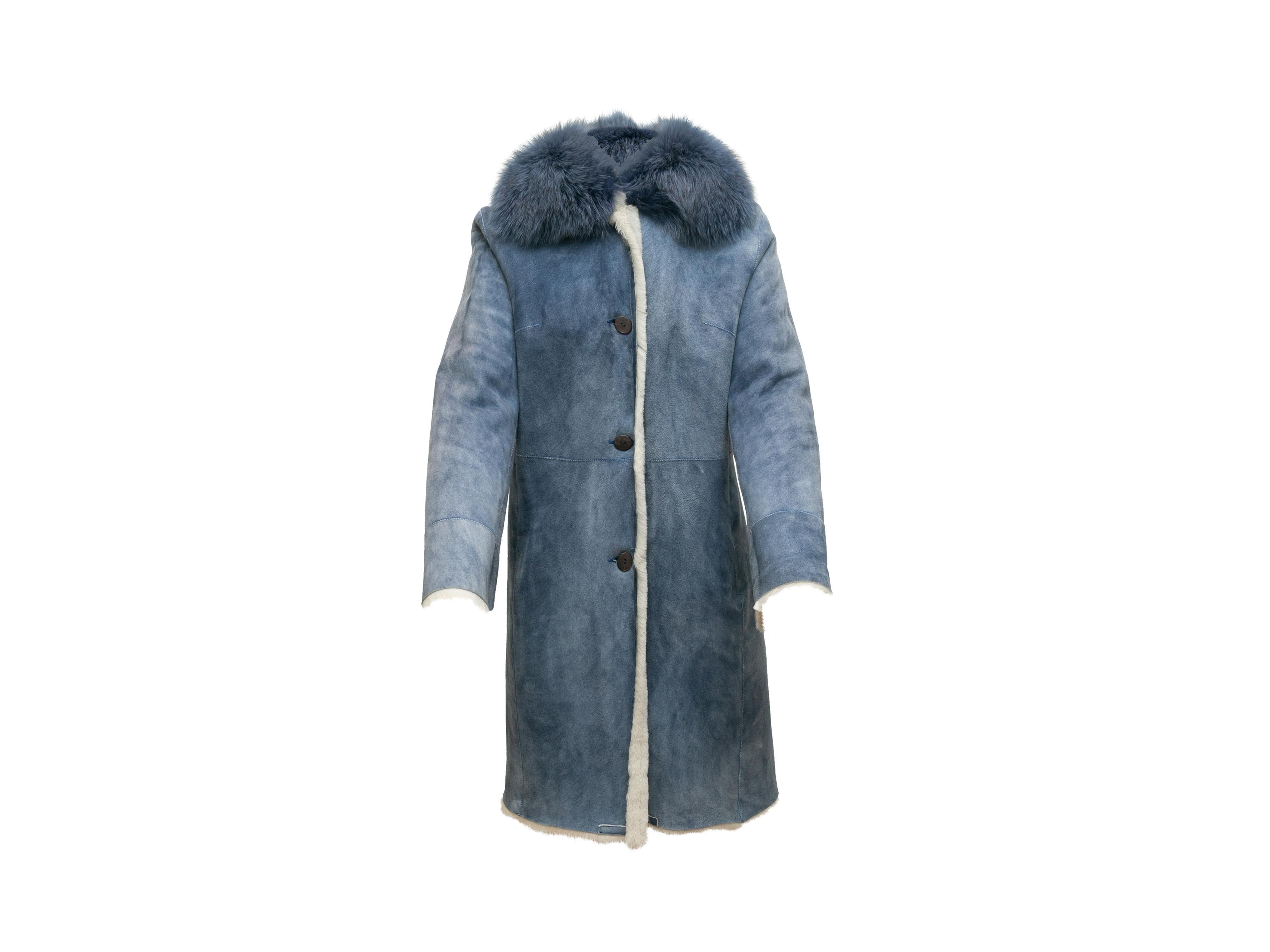 Product details: Blue and white shearling reversible belted coat by Toscana. Fox fur collar. Button closures at front. 39