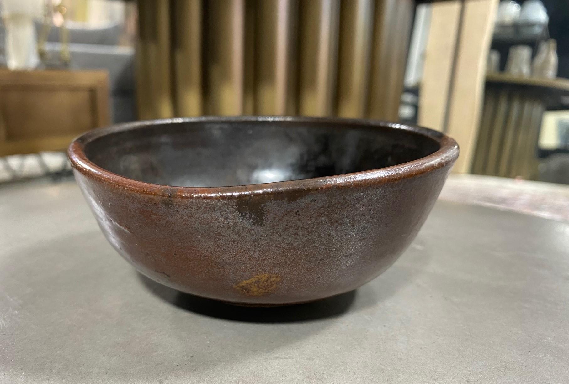 An absolutely gorgeous and wonderful footed chawan tea bowl by famed Japanese American pottery master Toshiko Takaezu. This work along with three others we have listed were acquired directly from the artist in the 1970s-90s by a collector who was a