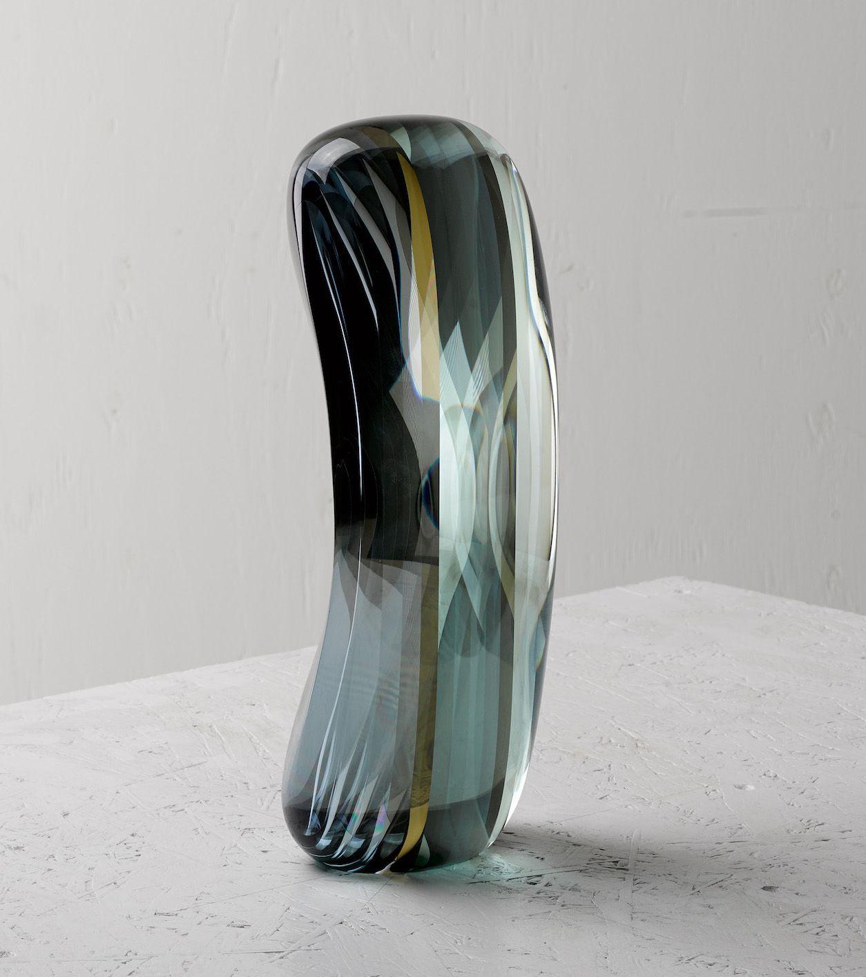 Heat reflecting glass and half mirror, 29 cm × 12 cm × 8 cm. Limited edition of 8. Delivered with a certificate of authenticity signed by the artist. 
In the ‘Move’ series, which began in the 2000’s, the artist presents vertical sculptures standing
