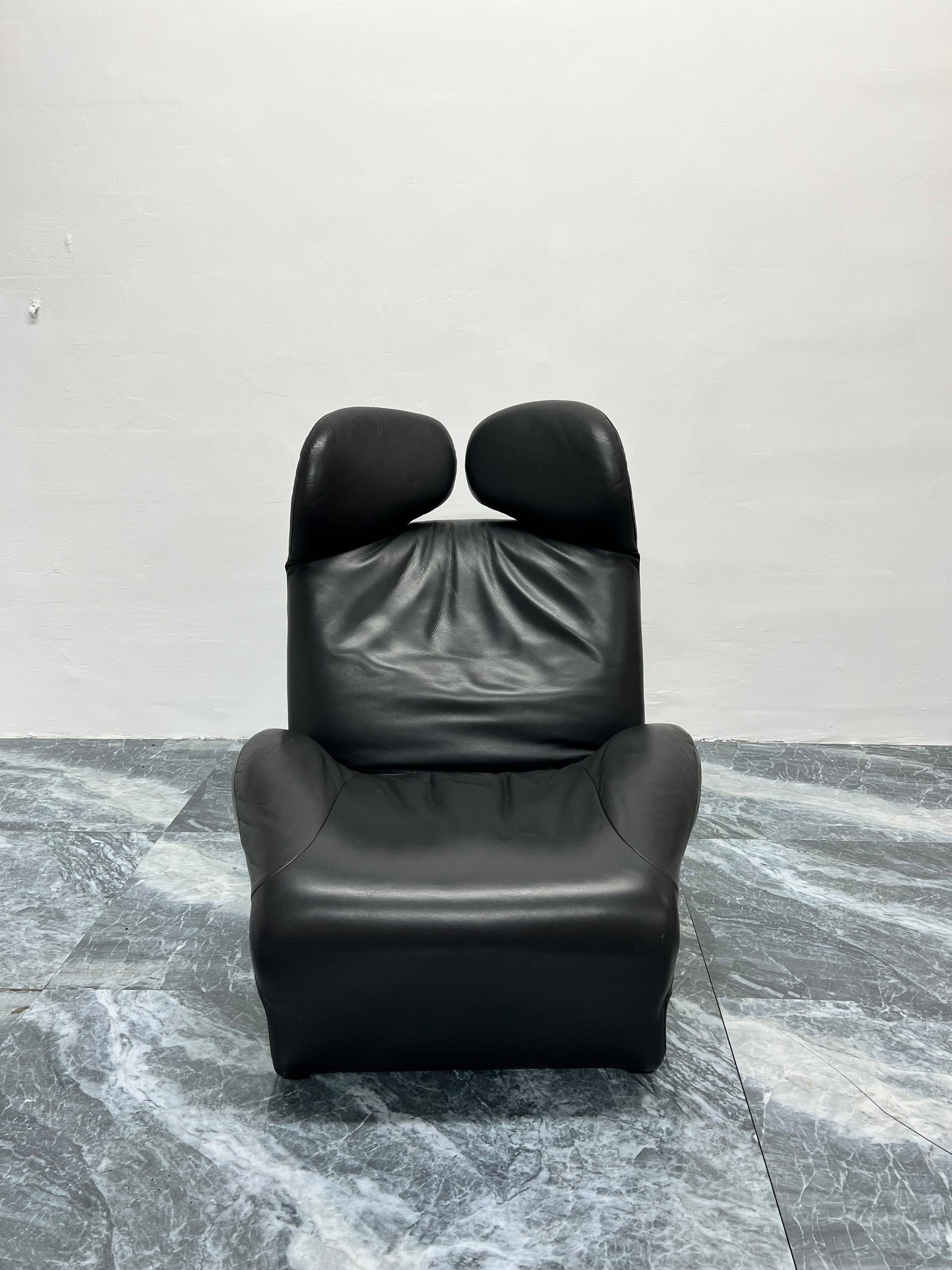 Charcoal gray leather Wink lounge chair designed by Toshiyuki Kita for Cassina, 1980s.

Wink rises out of the complex interweaving of Western ways and Asian influences, a versatile, eclectic design armchair that, by folding its base, becomes a
