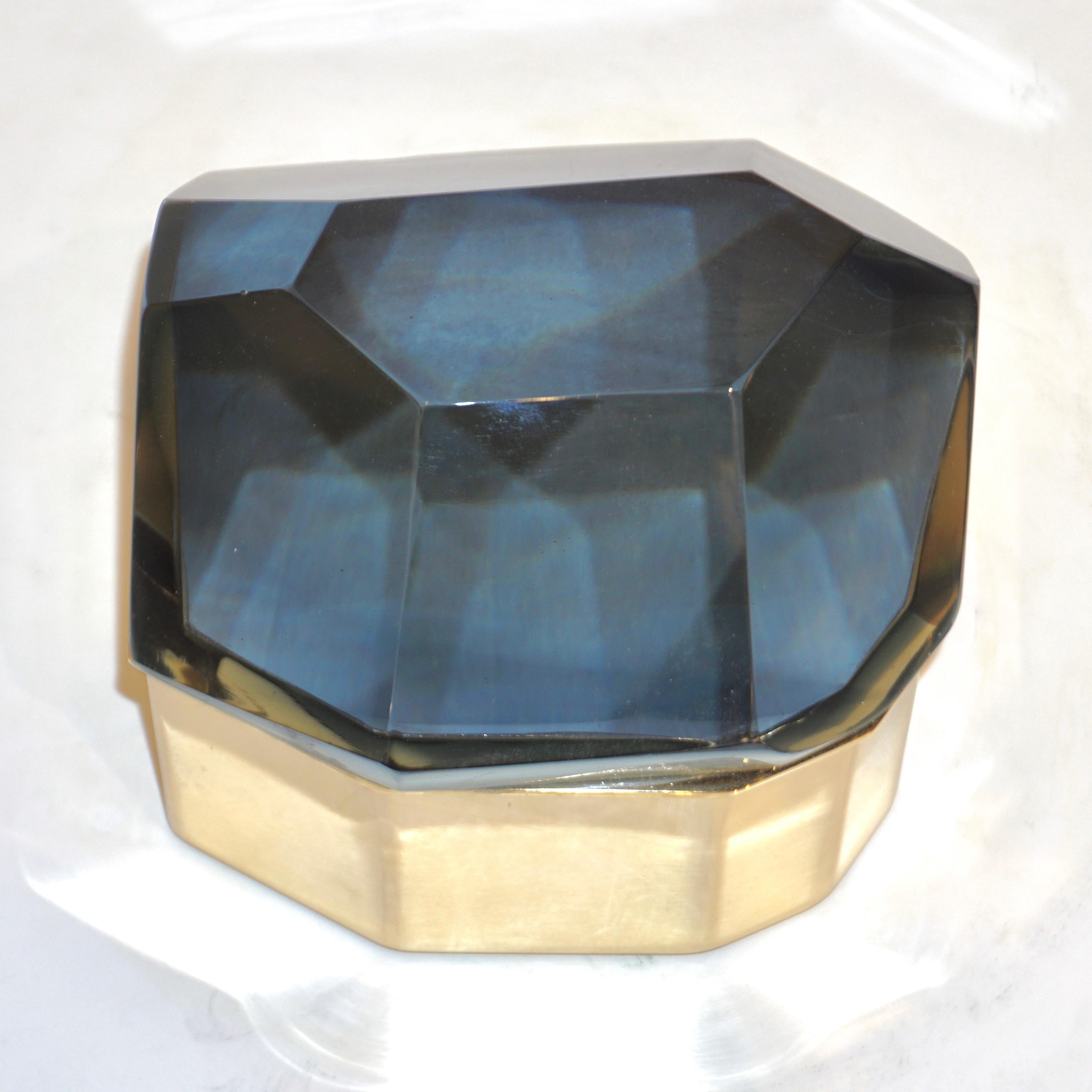 Italian contemporary organic casket, entirely handcrafted, by Toso Vetri d'Arte (Murano) with a freeform geometric brass case embellished by a smoked grey cover in blown rock Murano glass, handcut like a diamond. Available in other finishes and