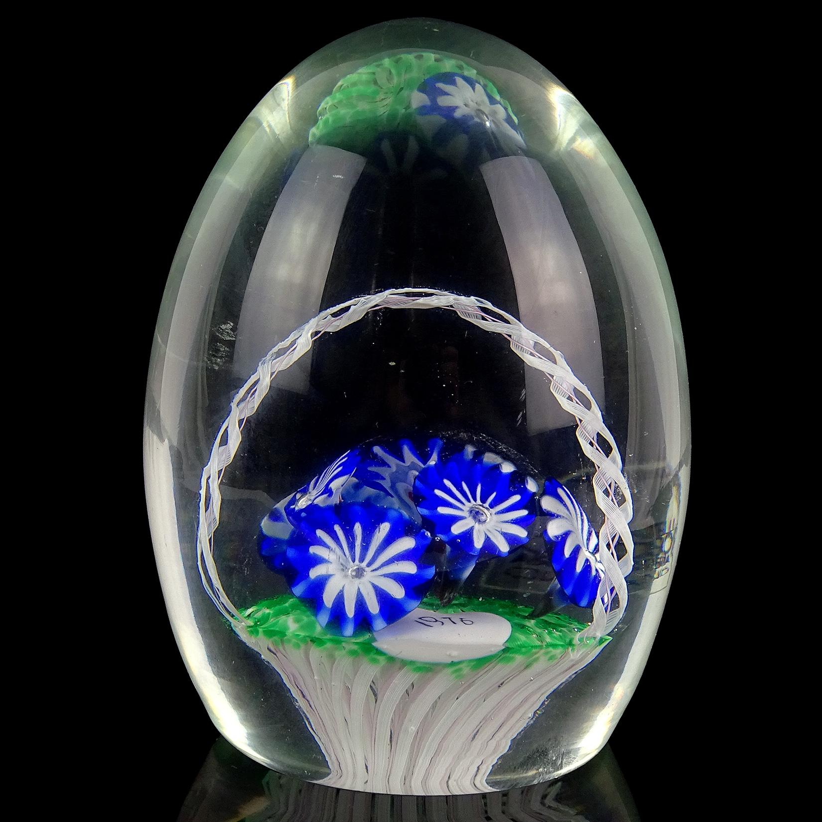 Beautiful vintage Murano hand blown white and pink Zanfirico ribbons basket with cobalt blue flower murrines Italian art glass paperweight. Documented to the Fratelli Toso company. The piece also has a 1976 date murrine, likely to commemorate a