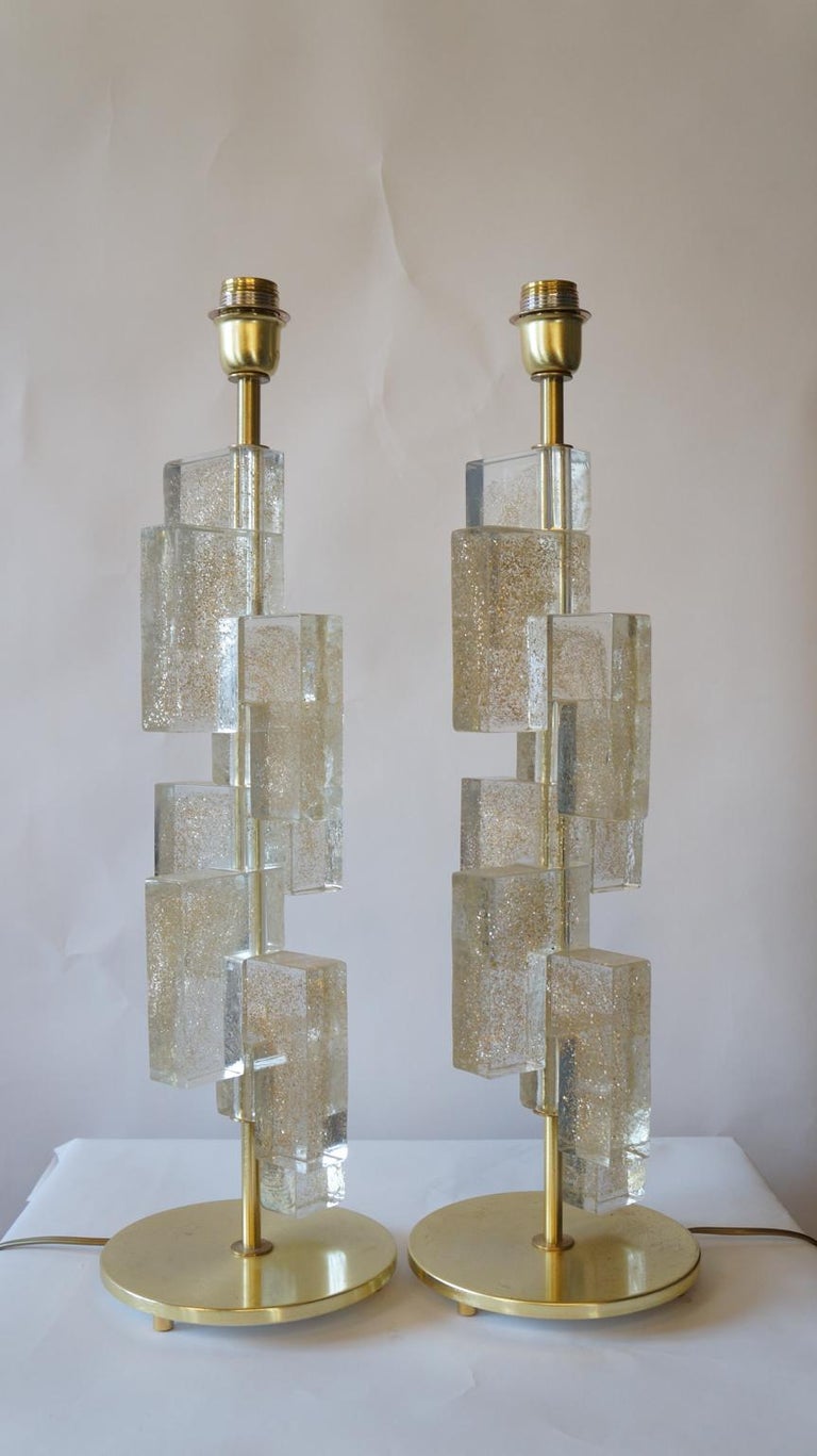 Designed by Toso Murano in 1983, this lamp is formed by 13 cm high blocks positioned vertically. 
It consists of 8 elements with gold powder inside, called 