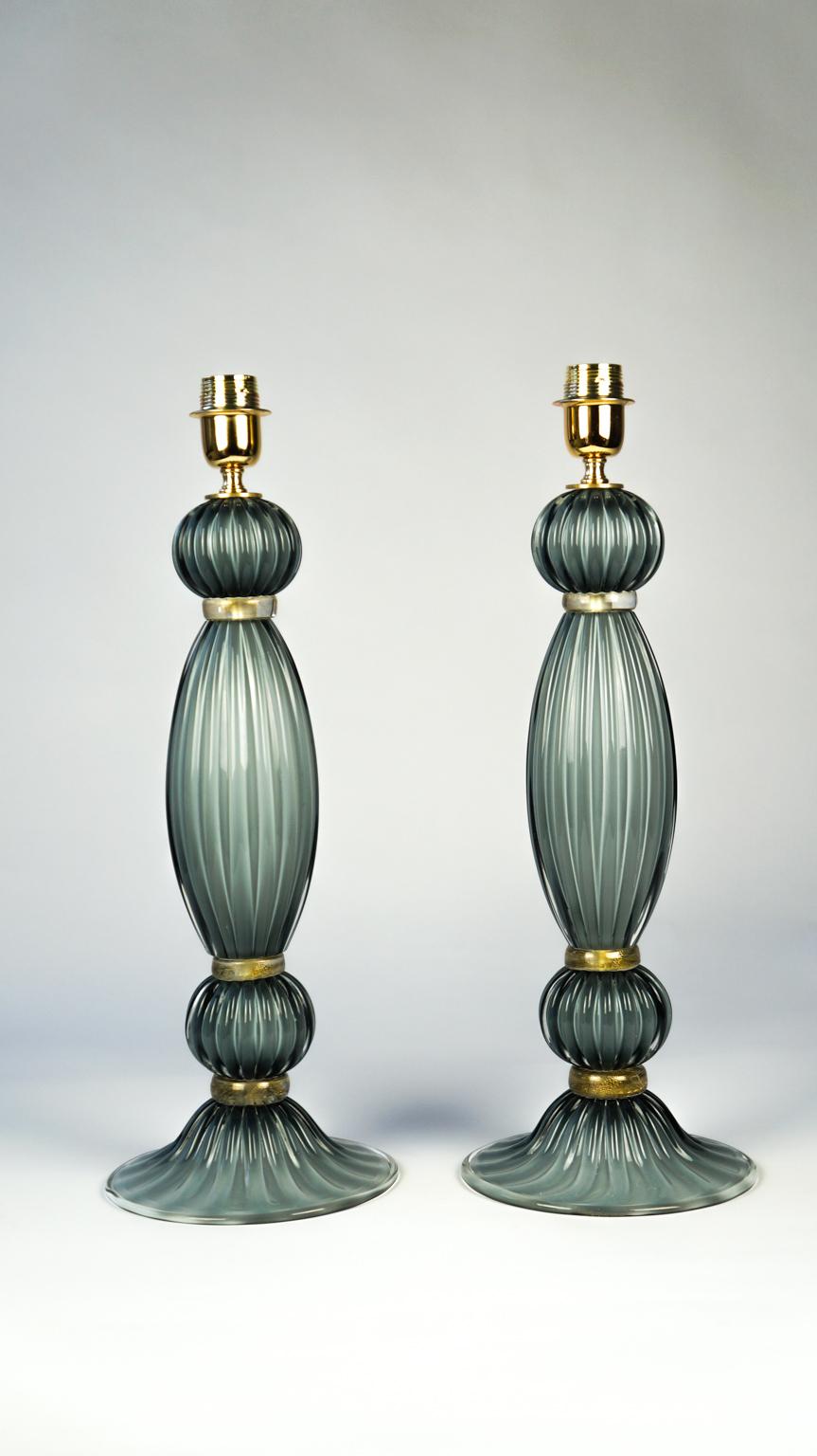 This lamp was designed in 1984 by Toso Murano. It is composed of two blown spheres, which enclose a central 