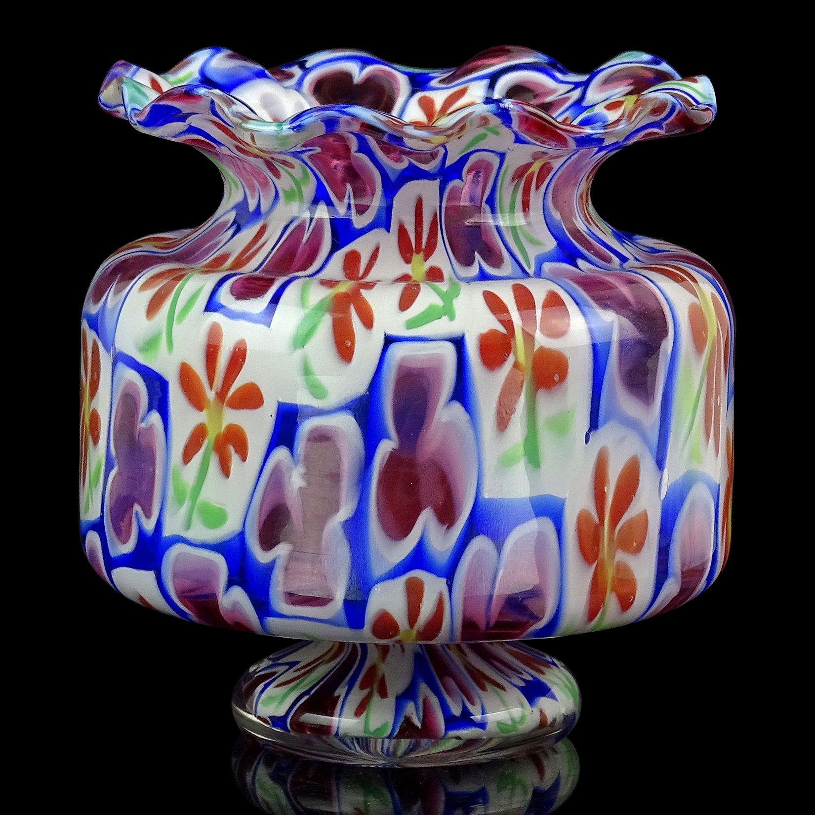 Beautiful vintage Murano hand blown Millefiori Murrina daisy flowers and clovers Italian art glass cabinet / bud vase. Documented to the Fratelli Toso Company. It has a crimped ruffle rim, with very unusual shape and pattern. The mosaic design has