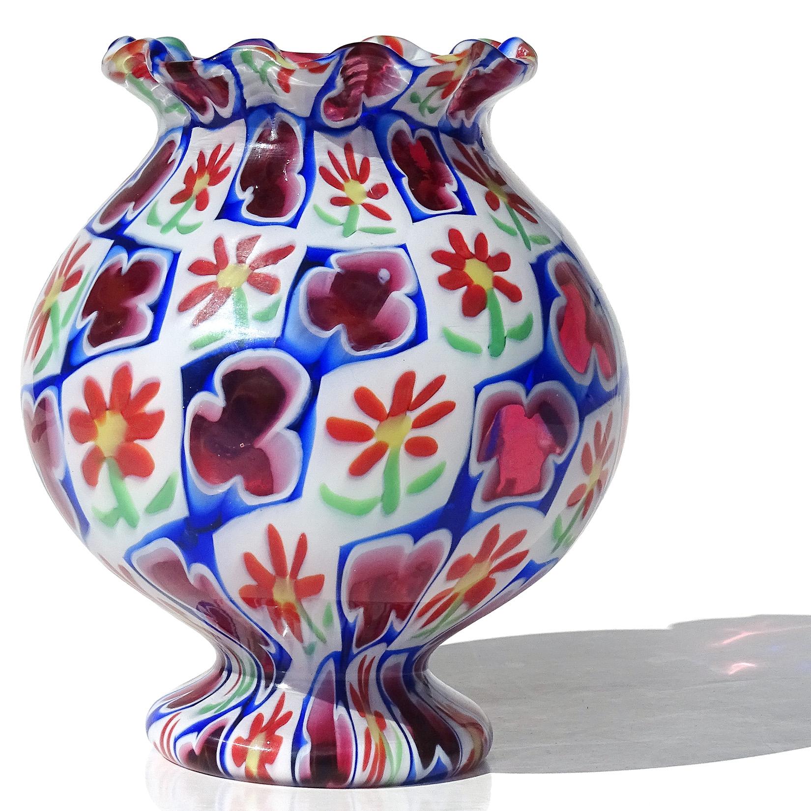 Beautiful vintage Murano hand blown Millefiori Murrina daisy flowers and clovers Italian art glass mosaic cabinet / bud vase. Documented to the Fratelli Toso Company. The vase has a crimped ruffle rim, with very unusual bulb shape and pattern. The