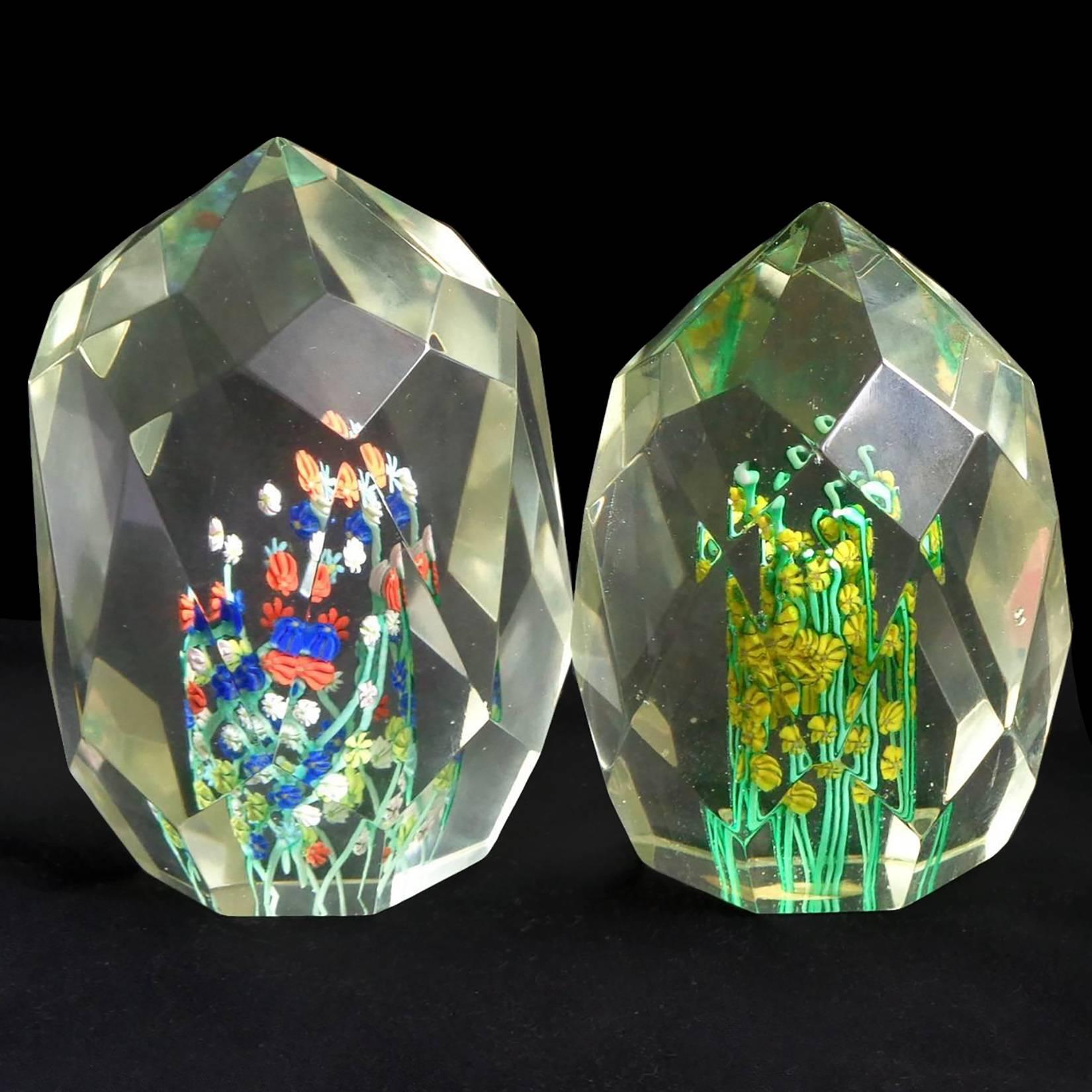 Beautiful pair of Murano handblown, diamond cut faceted wild flower Italian art glass paperweights. Documented to the Fratelli Toso company. Each has its own different cut surface, and different flower colors.