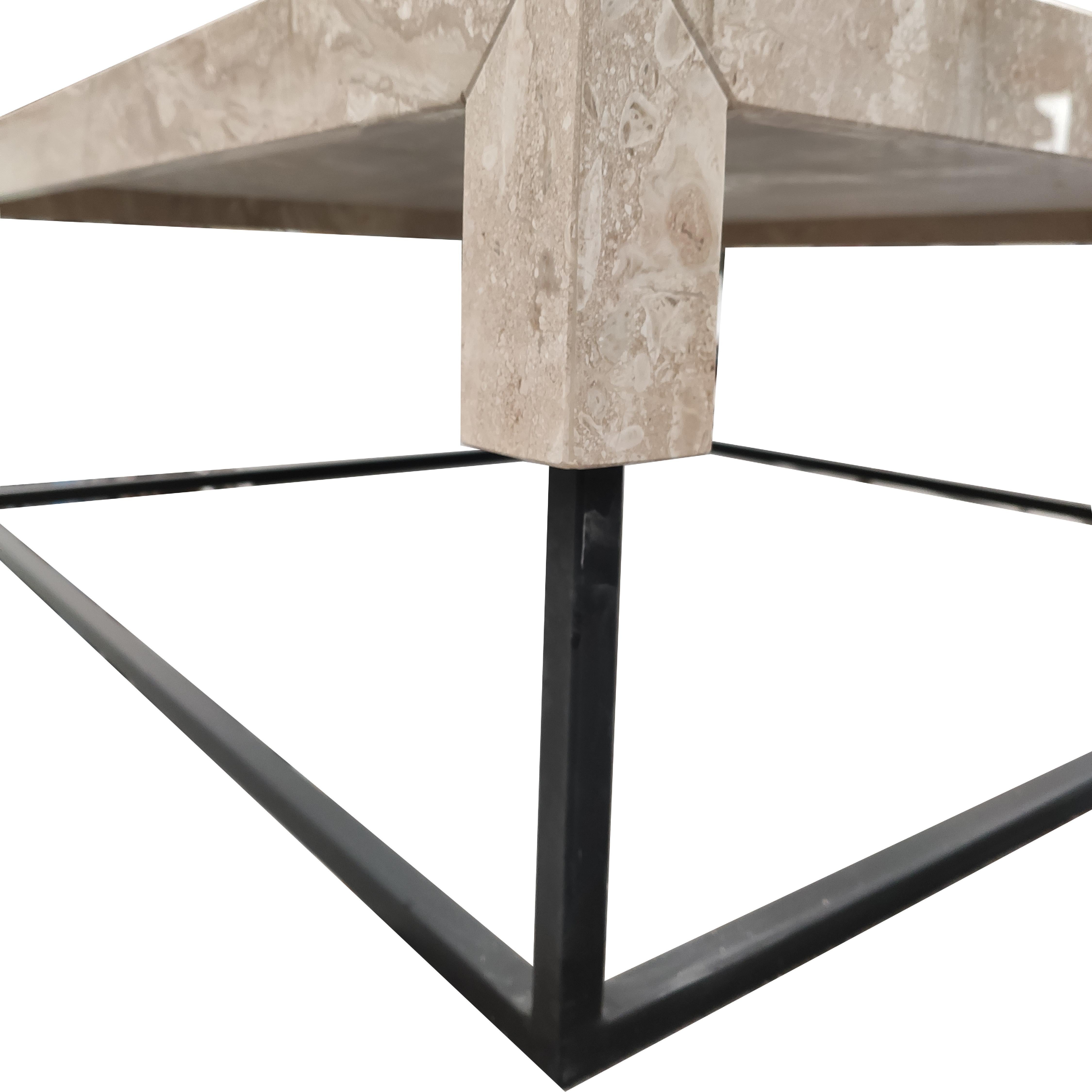 The Daino Reale TOSSA coffee table is a piece of contemporary designer furniture in marble. It is a coffee table made of Daino Reale marble, a marble from the Italian island of Sardinia.

The table consists in a black painted metal structure, with