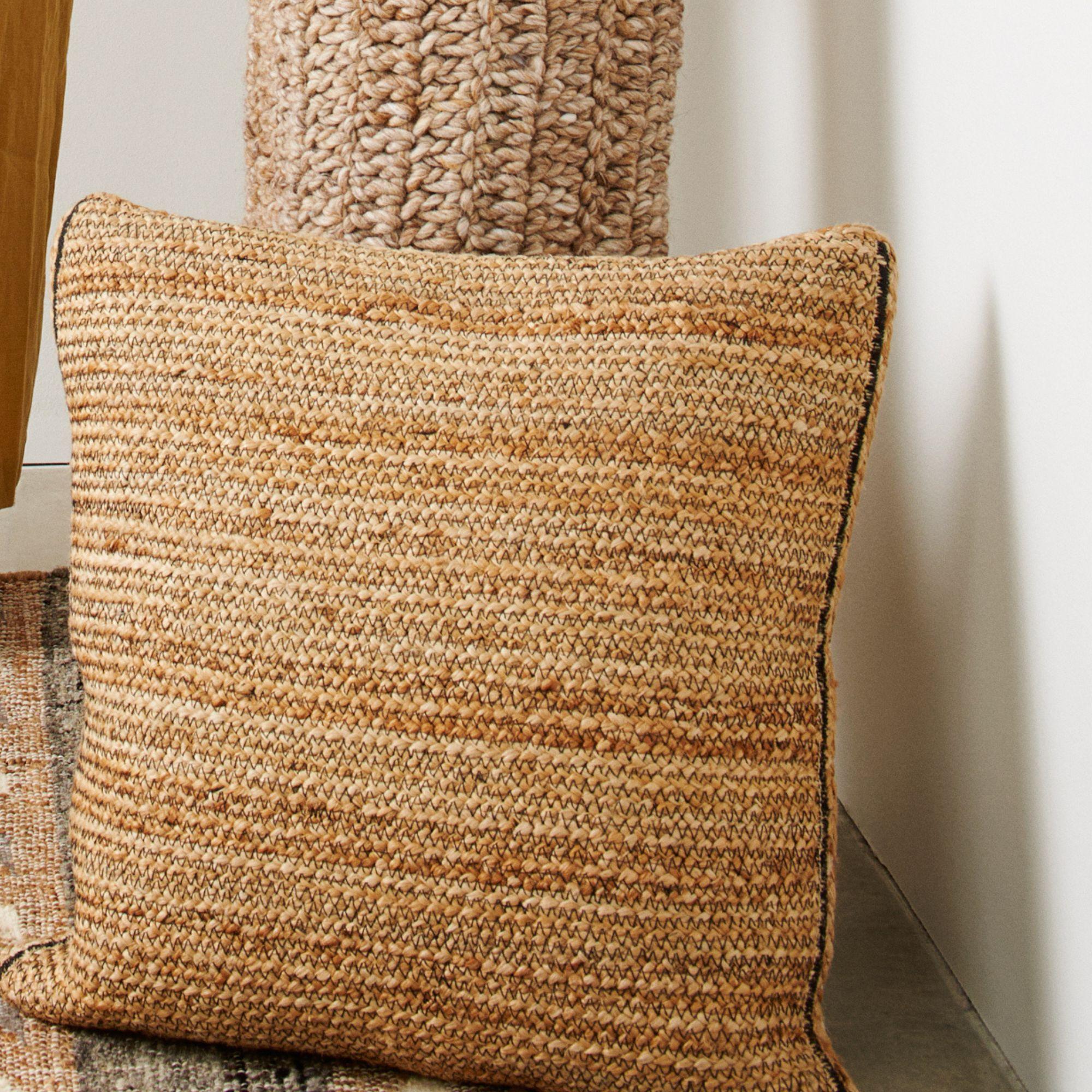 Tossa Pillow is a slightly textured and weighted braided pillow. Natural fiber jute has been used to  breathe life in this neutral style of pillow.  The beauty of this pillow is in its pure design that stands out with the use of undyed yarns left in
