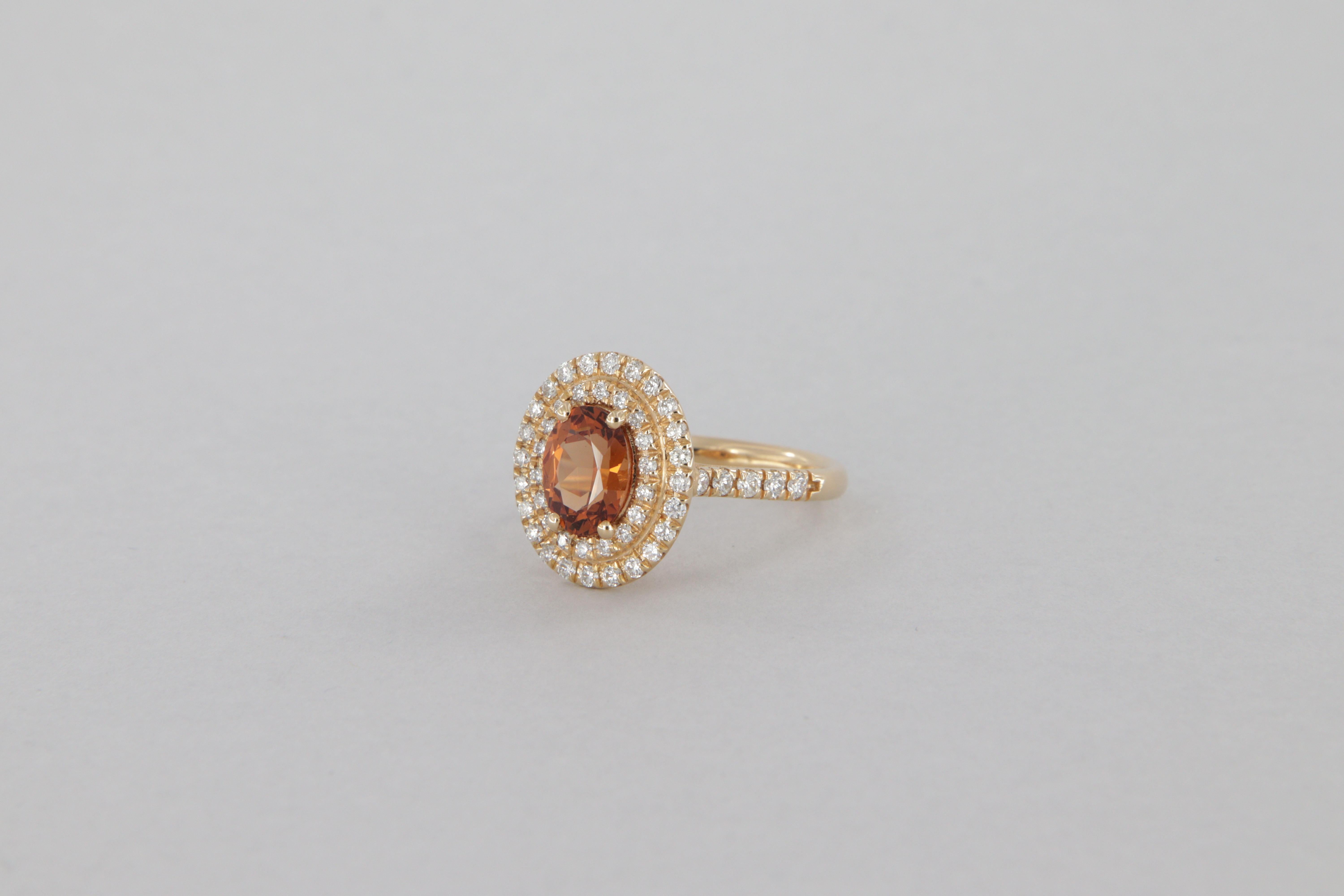 Contemporary 1.70 carat diamond and garnet halo ring in gold For Sale