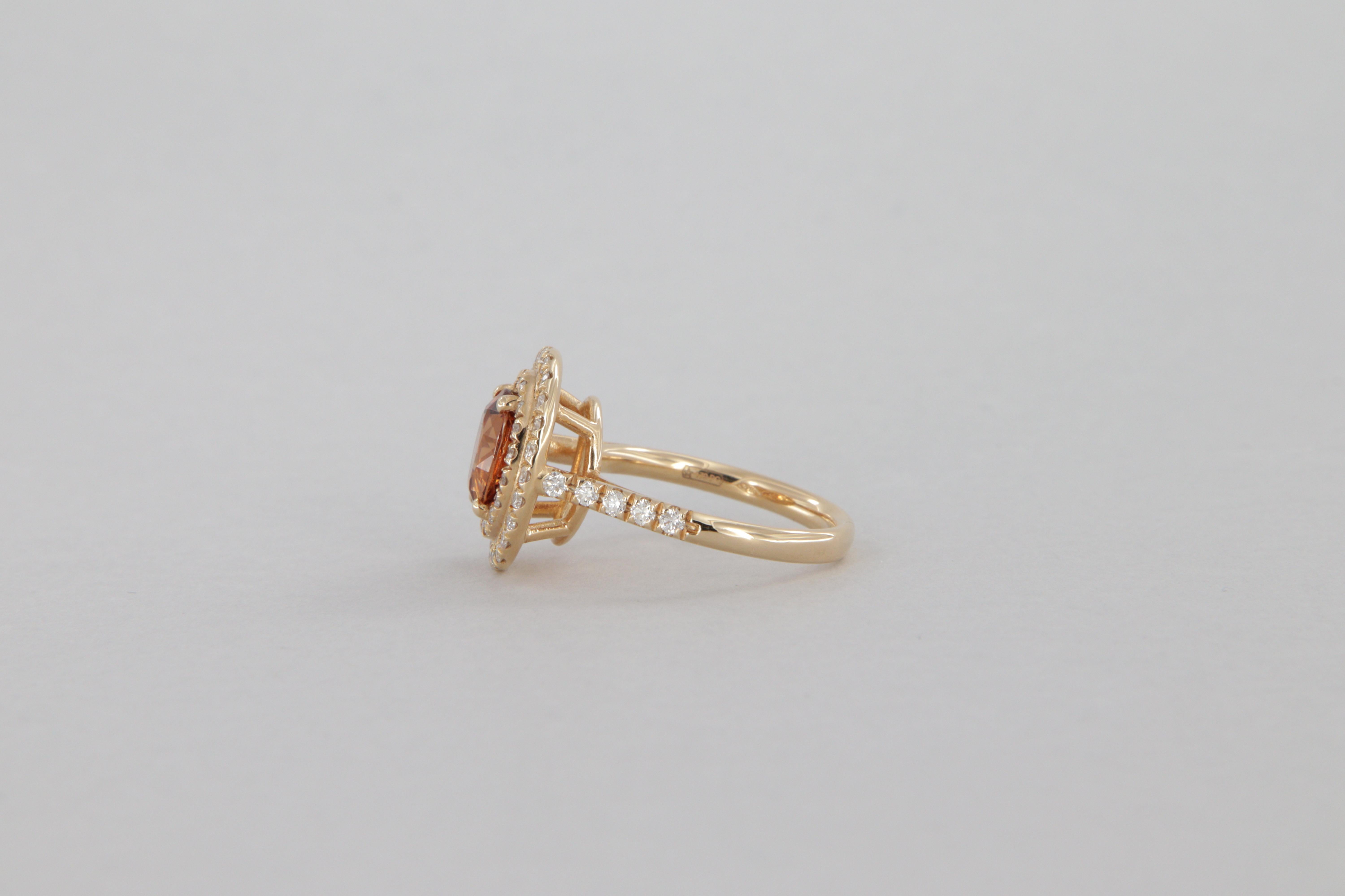 Oval Cut 1.70 carat diamond and garnet halo ring in gold For Sale