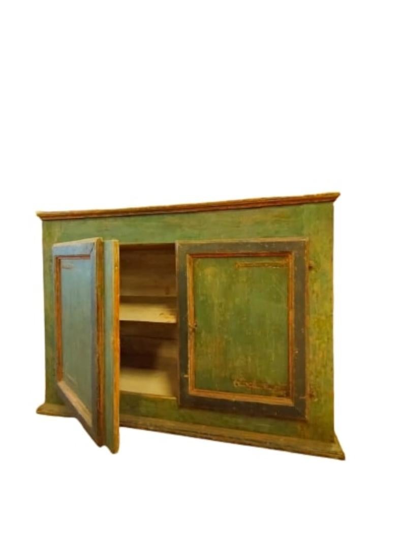 Rustic sideboard with original tempera lacquer in light blue, with yellow ochre frame.

Of Umbrian-Marches provenance, it shows two large doors and opening shelf.

Entirely original cabinet, it has been conservatively restored 

Measures: L. cm 139