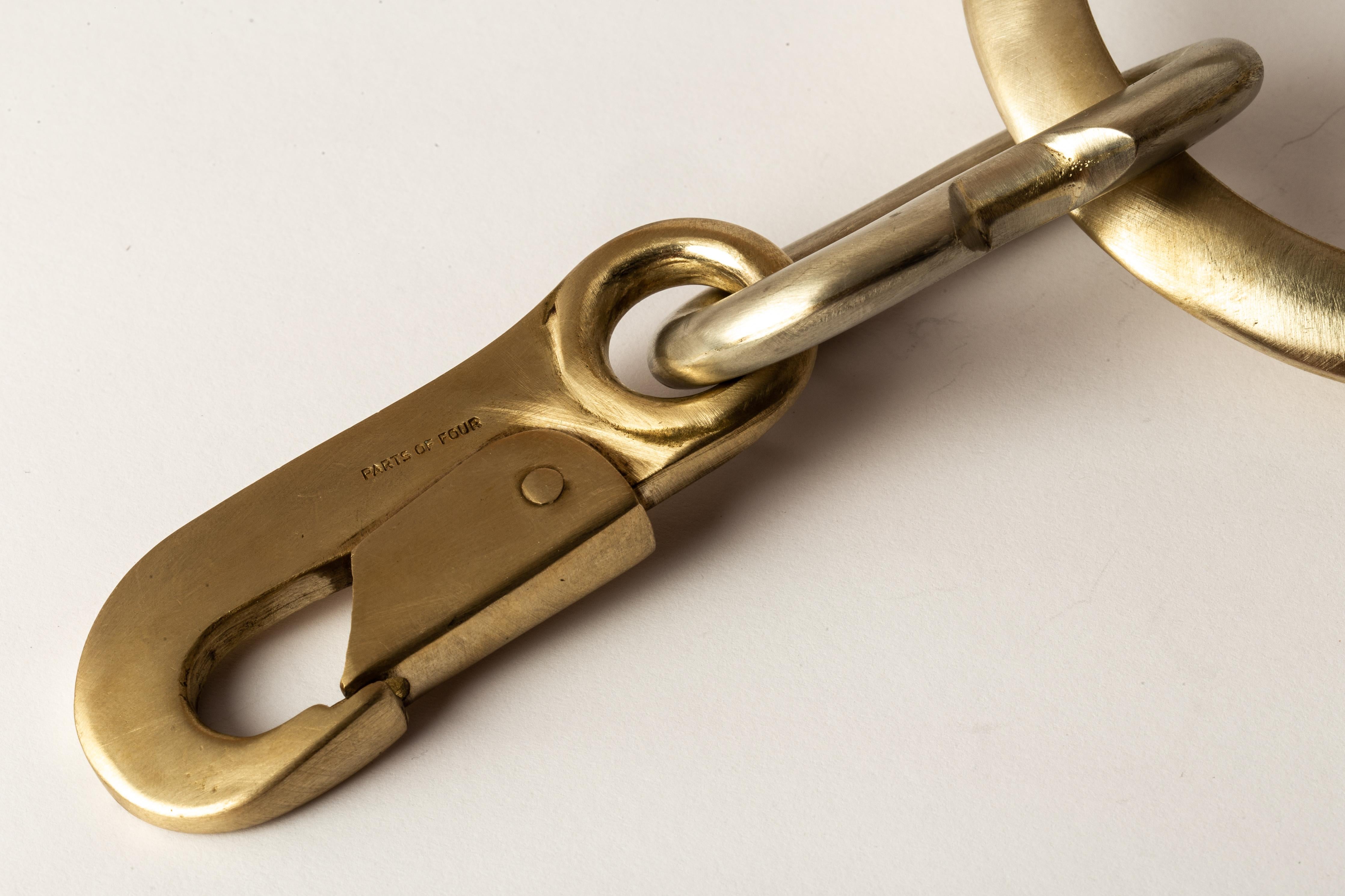Totemic chain necklace made from combination of matte white bronze and brass.
The Charm System is an interrelated group of products that can be mixed and matched or worn individually.
Chain length (closure to closure): 500 mm
Weight: 295 grams