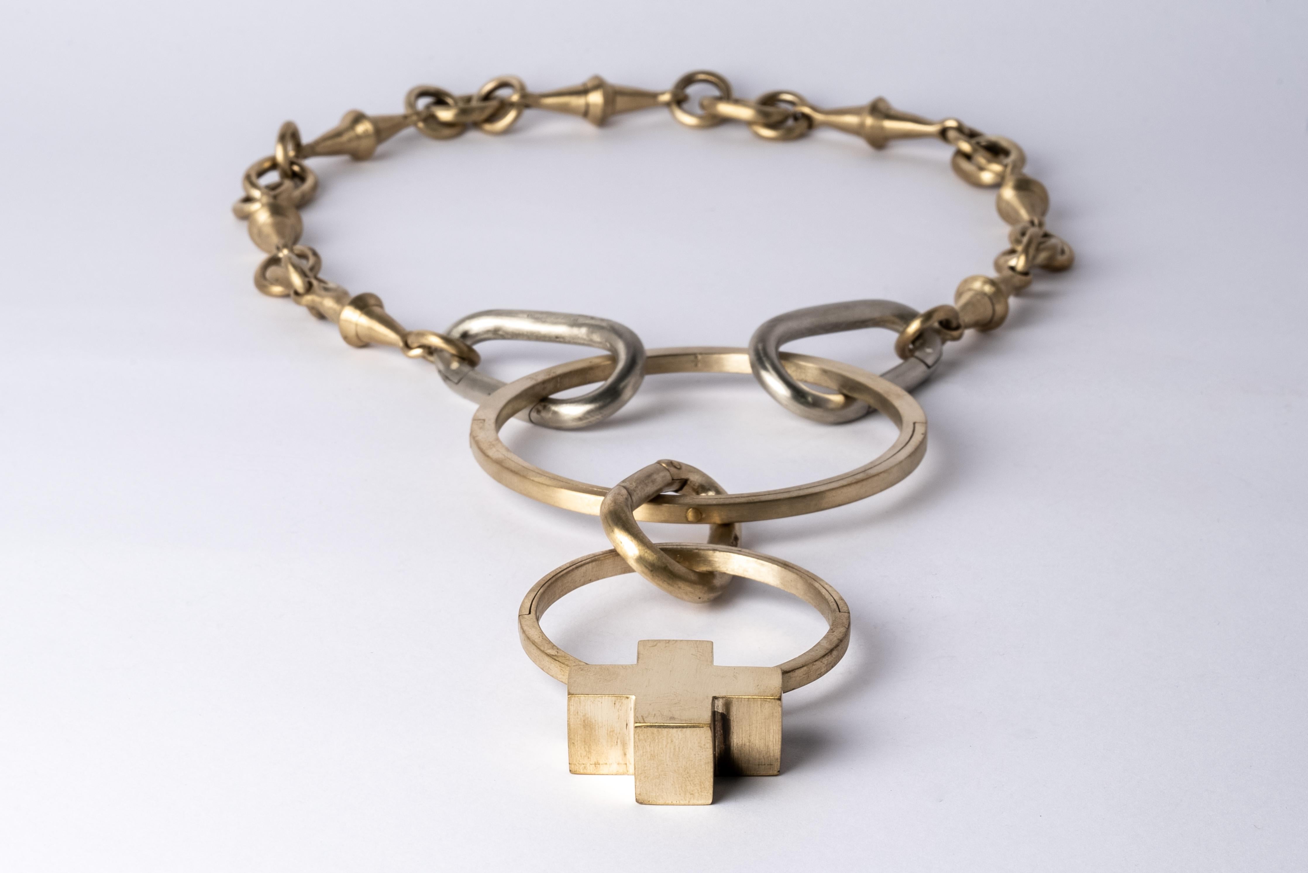 Totemic chain necklace made from combination of brass and bronze.
The Charm System is an interrelated group of products that can be mixed and matched or worn individually.
Chain length (closure to closure): 715 mm
Mini plus on portal length: 79 mm
