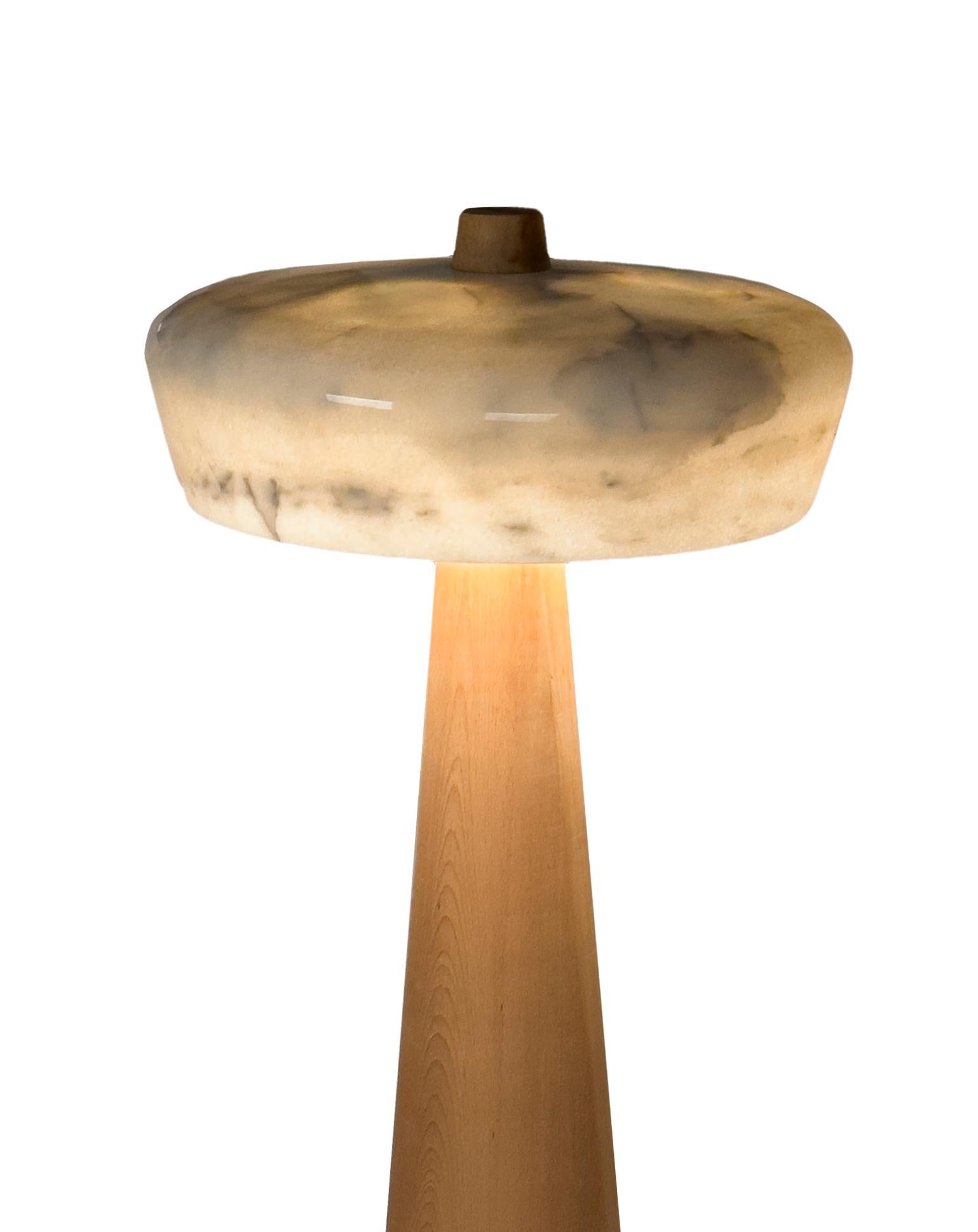 TOTEM floor lamp. A modern design statement with a subtle Pharaonic flavor.

Designed and handmade in Egypt using traditional methods of craftsmanship. 
Base in solid oak, offered in natural, walnut or black stain. Also available in custom colors
