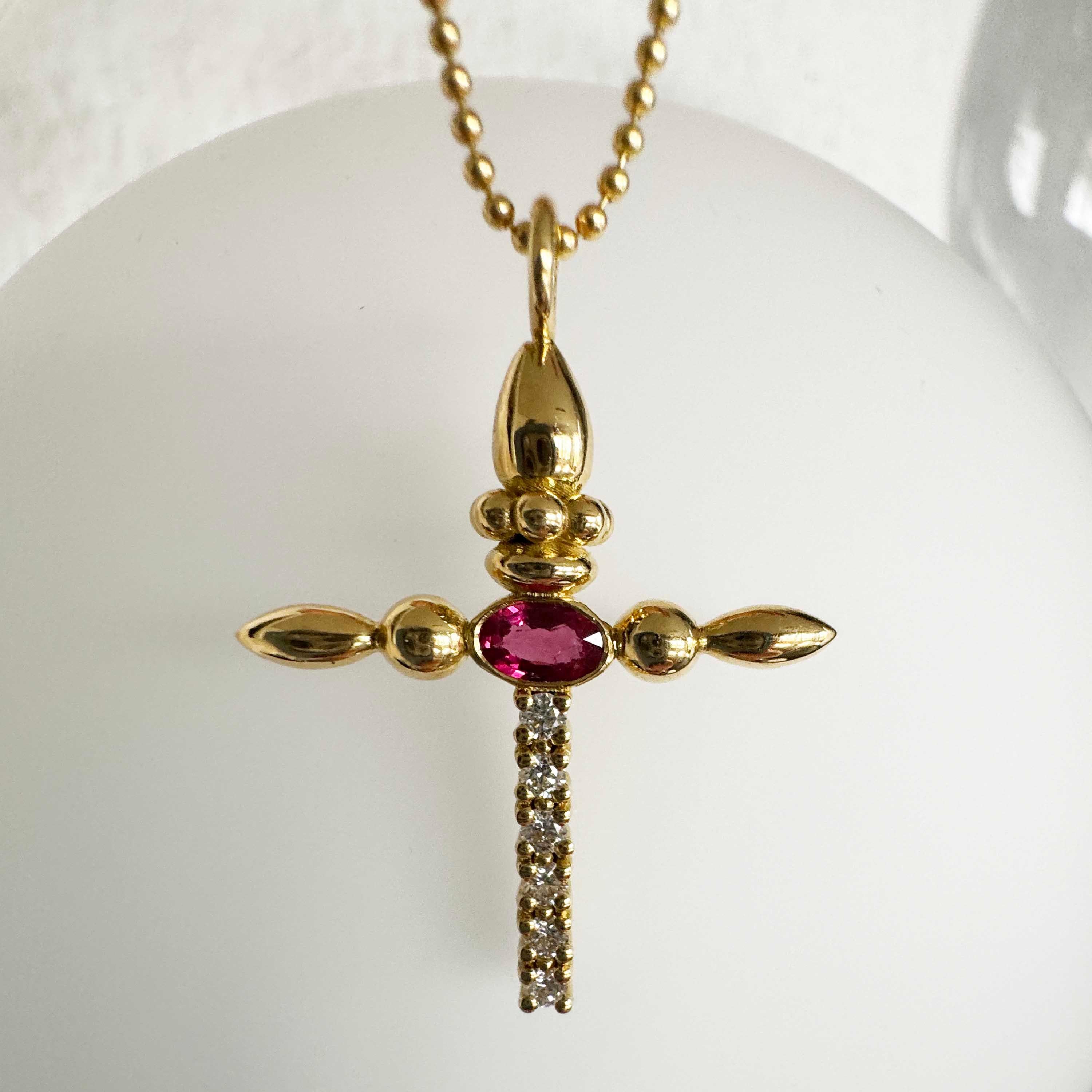 Designer: Alexia Gryllaki

Dimensions: motif L30x23mm, chain 500mm
Weight: approximately 7.1g  (inc. chain)
Barcode: NEX3016


Totem cross pendant in 18 karat yellow gold with a 500mm ball-chain set with an oval ruby approx. 0.33cts and round