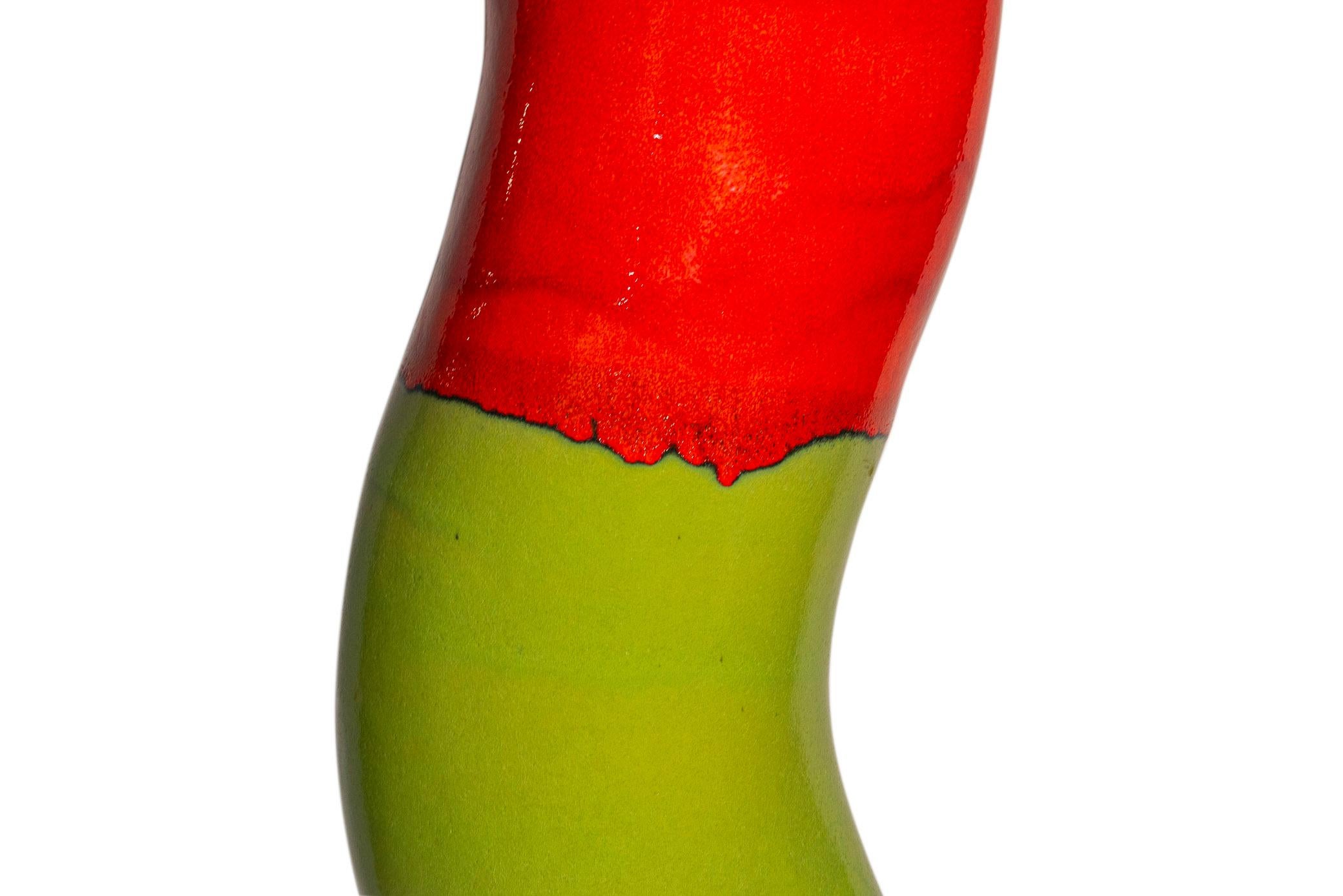 Totem,
Lacquered ceramic,
One half green and one half red, 
Made of one piece,
France, circa 1970.

Measures: Height 165 cm, diameter 27 cm.