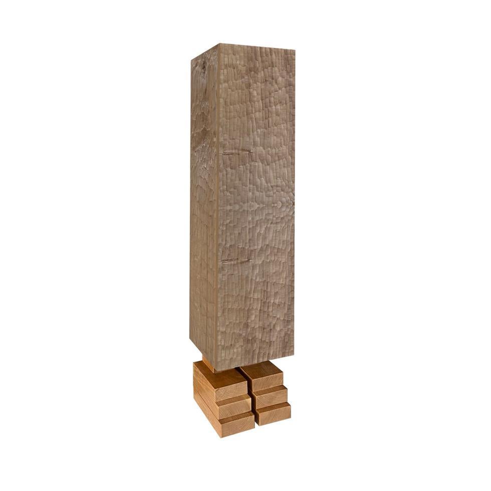 This one-of-a-kind cabinet designed by Pietro Meccani is a gem of artisan woodworking of exceptional sculptural impact. Inspired by Indigenous totems, its towering structure combines European larch and maple for the storage unit, while cherry is