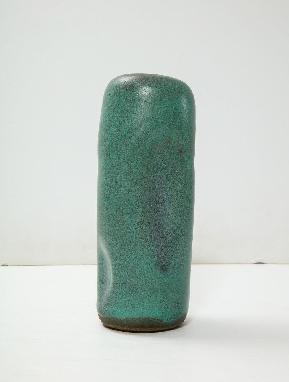 Cylindrical leaning TOTEM-form, hand built with indentations, green glazes. Artist-signed to underside.