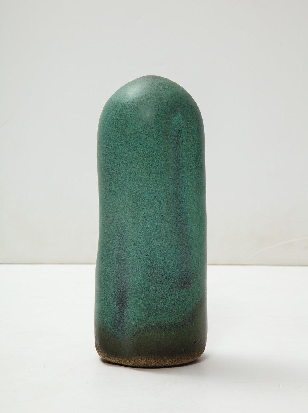 Cylindrical TOTEM-form. Hand built with rounded top, smooth oblong indentations, in green glazes. Artist-signed to underside.