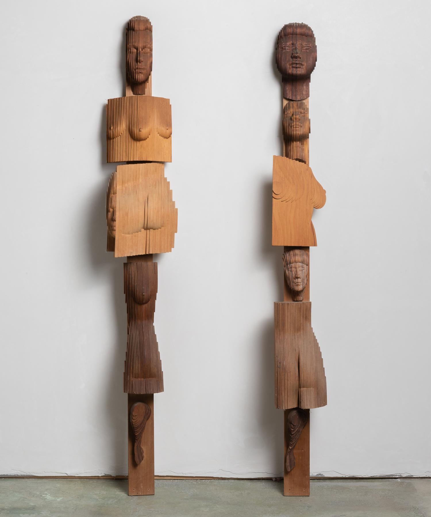 TOTEM Sculptures by Reuben Karol, America, 20th century.

A pair of totemic forms composed of hybrid female figures constructed of thinly slatted wood.

Measures: 10.5