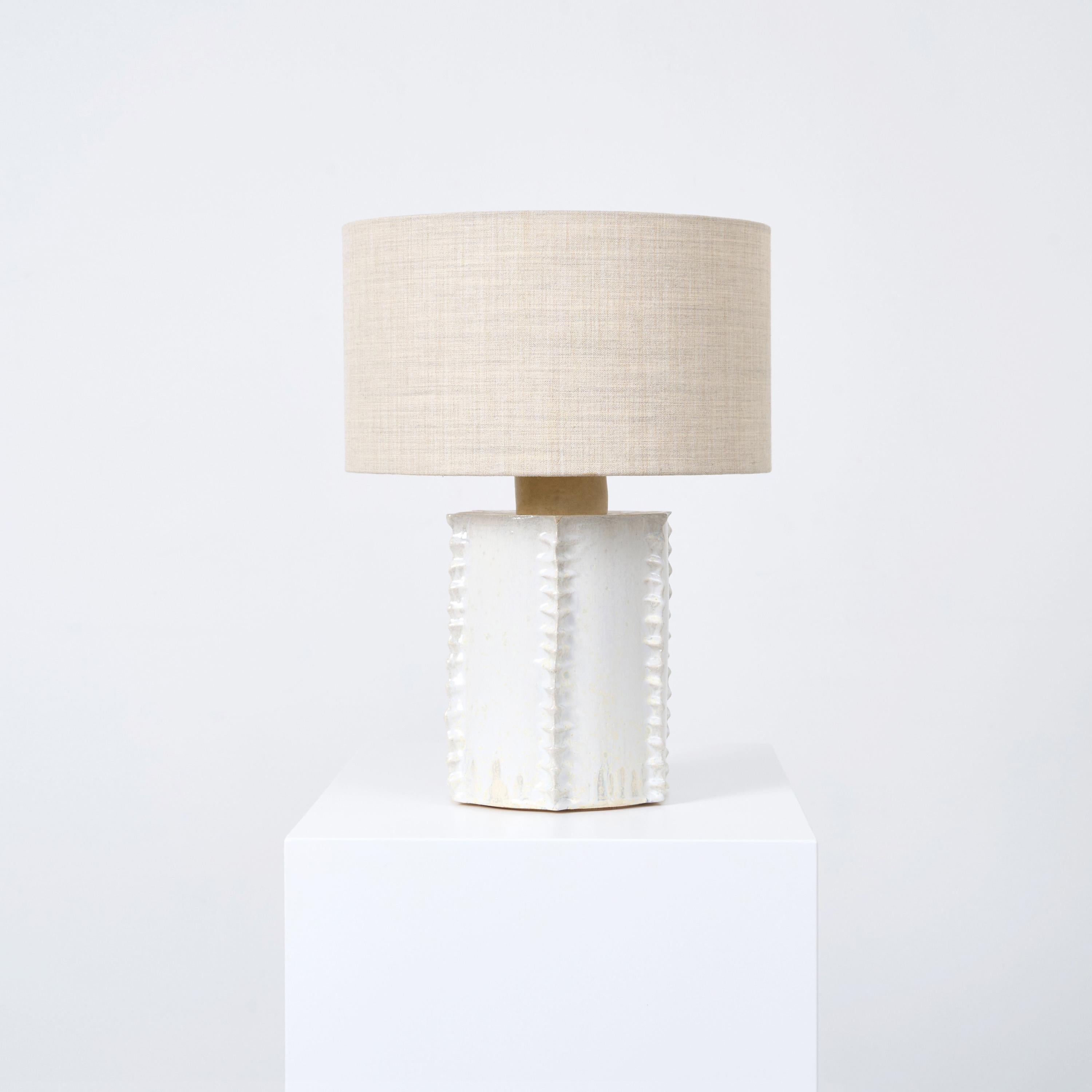 TOTEM TABLE LIGHT, designed in 2023.

Artisanal ceramic light with a textured detailing, made in Project 213A's own ceramic workshop. Each piece is unique due to its handmade nature, shapes and shades of the ceramic base can vary slightly.

Bespoke