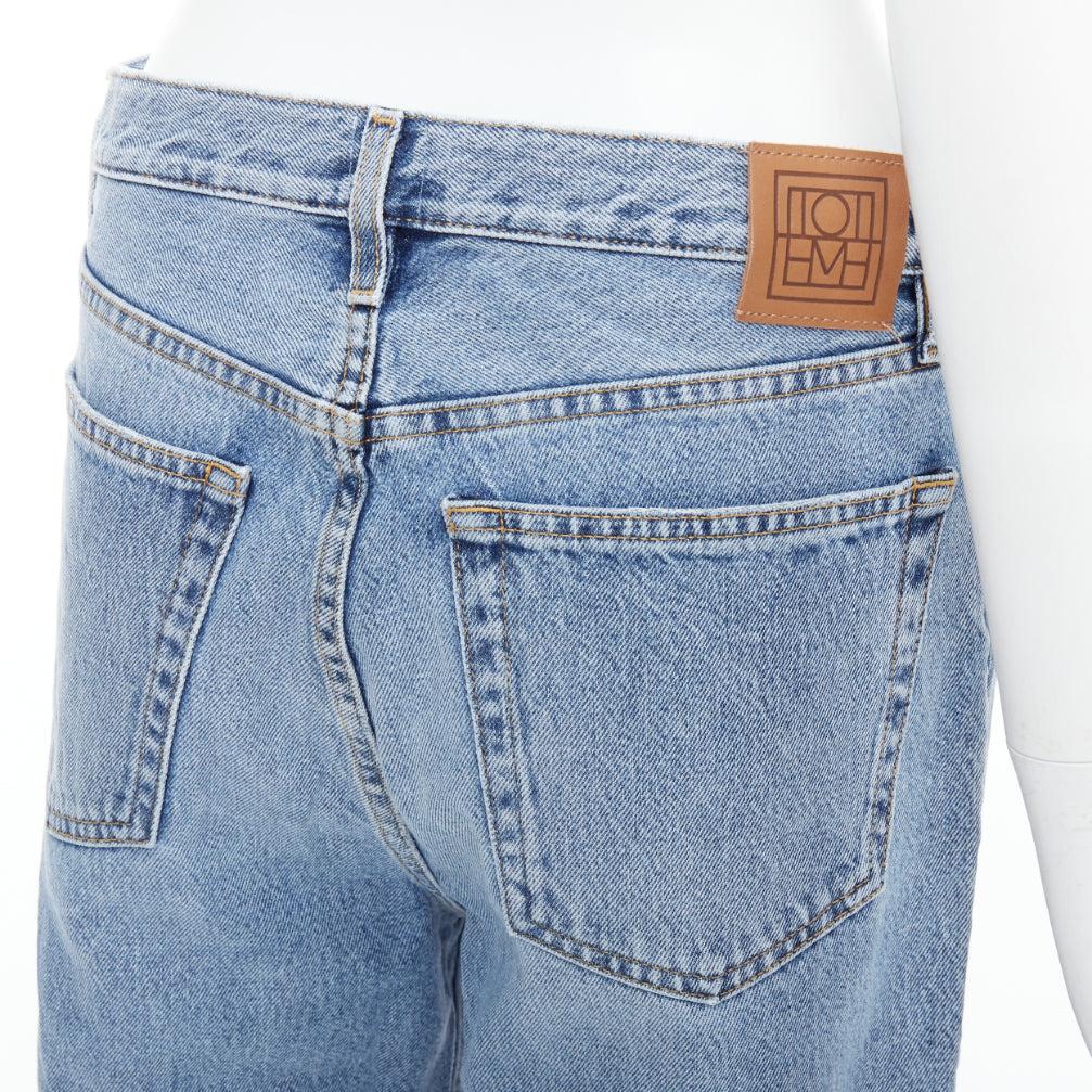 TOTEME Classic Cut mid blue washed wide leg frayed hem jeans 28