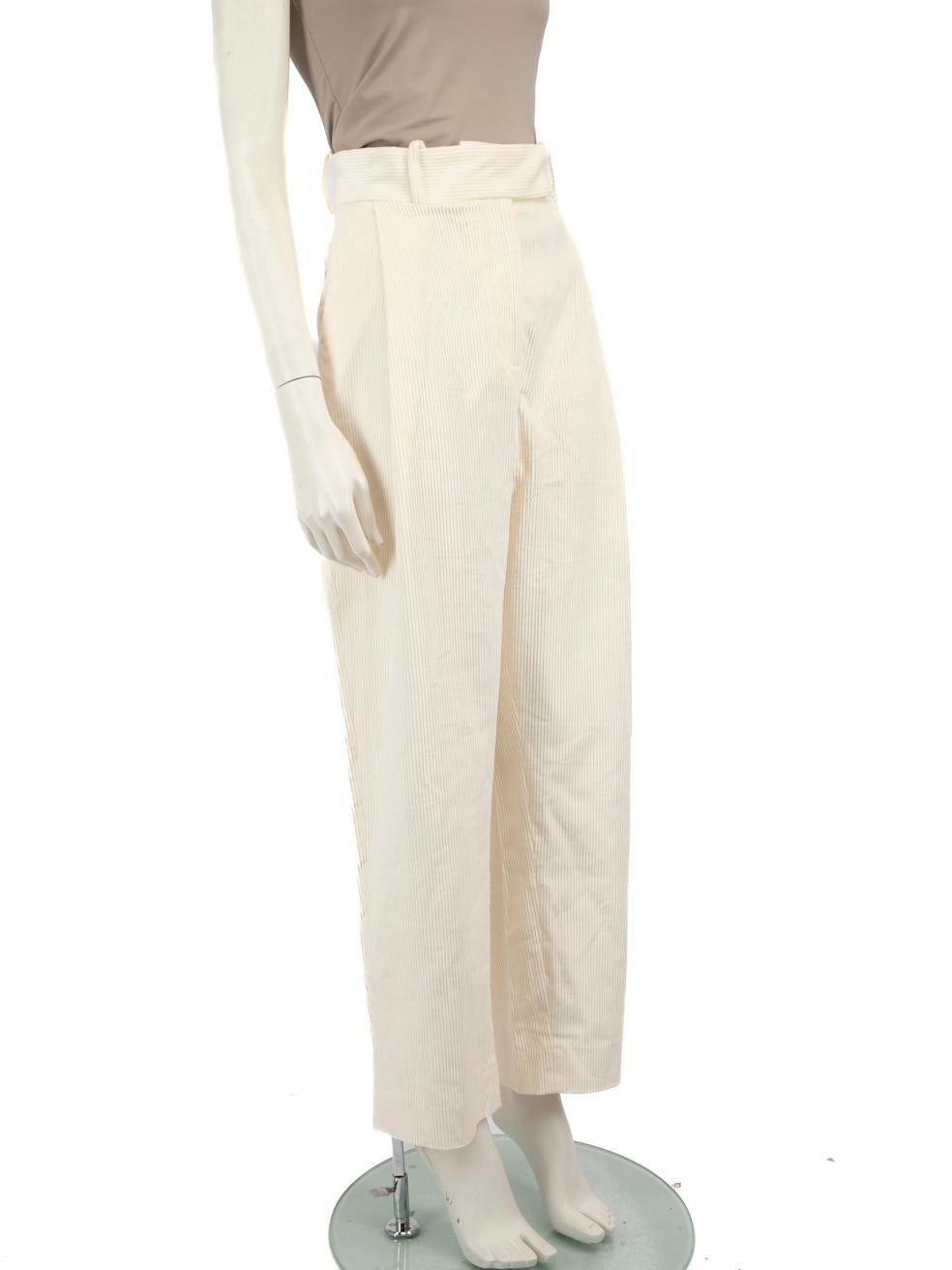 CONDITION is Very good. Minimal wear to trousers is evident. Minor discolouration marks on the right side of the front near the zipper and tarnishing of buckle on this used Totême designer resale item.
 
 Details
 Ecru
 Corduroy
 Trousers
 Wide leg
