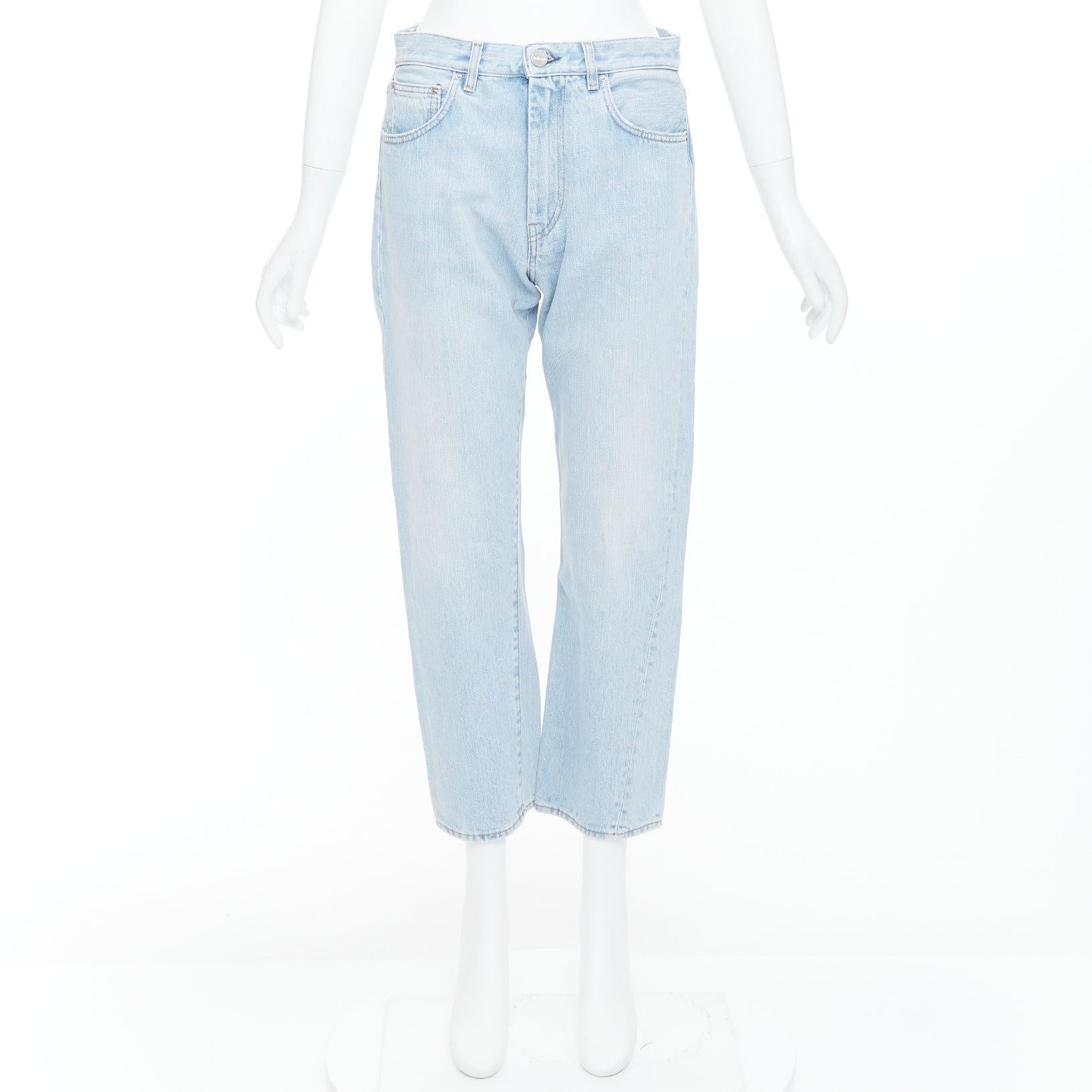 TOTEME Twisted Seam light blue washed denim asymmetric jeans 27