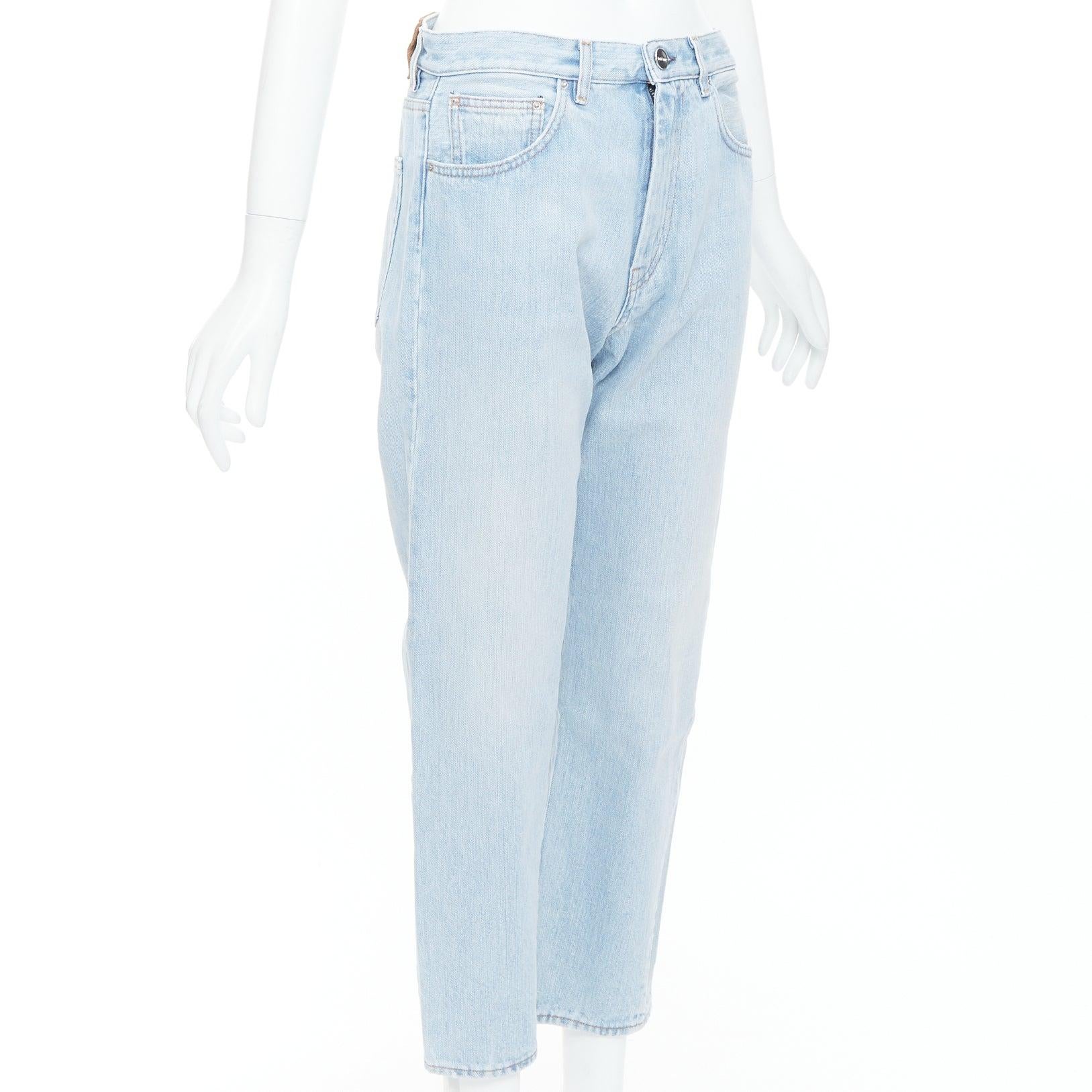Blue TOTEME Twisted Seam light blue washed denim asymmetric jeans 27