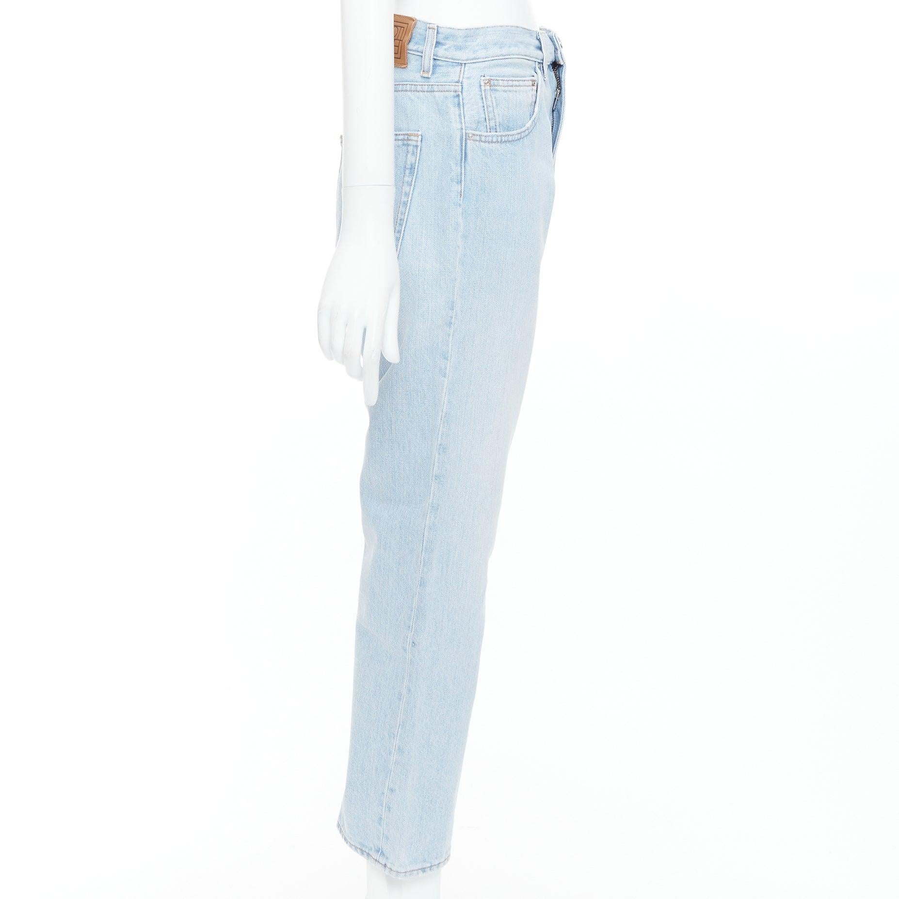 TOTEME Twisted Seam light blue washed denim asymmetric jeans 27