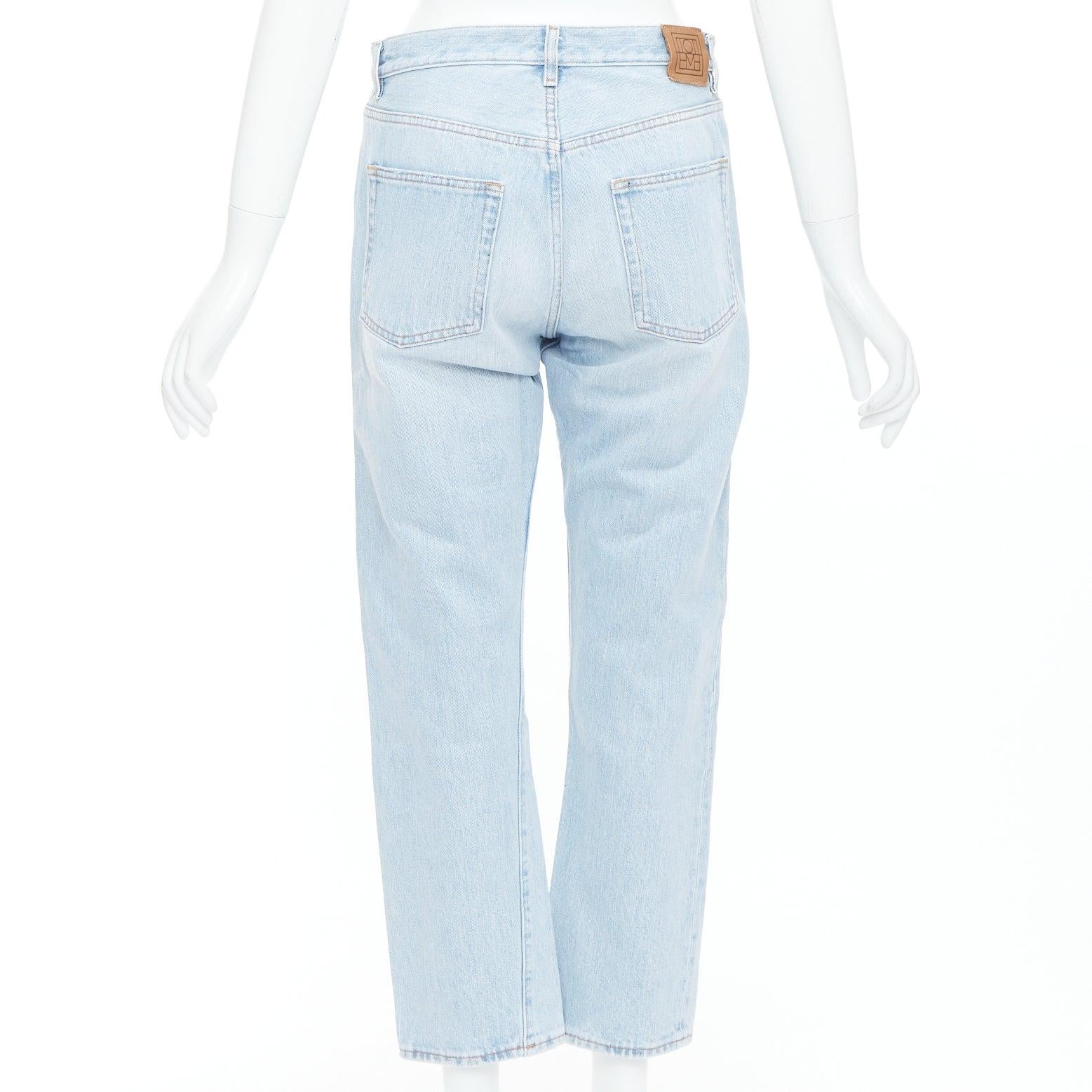 Women's TOTEME Twisted Seam light blue washed denim asymmetric jeans 27
