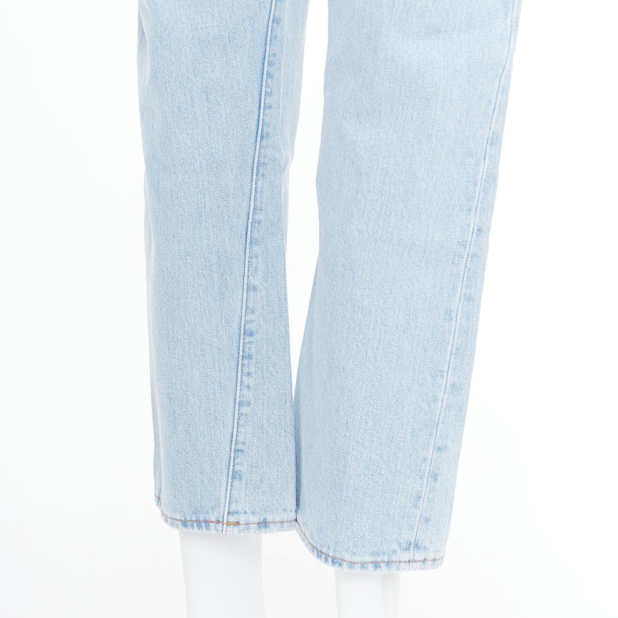 TOTEME Twisted Seam light blue washed denim asymmetric jeans 27