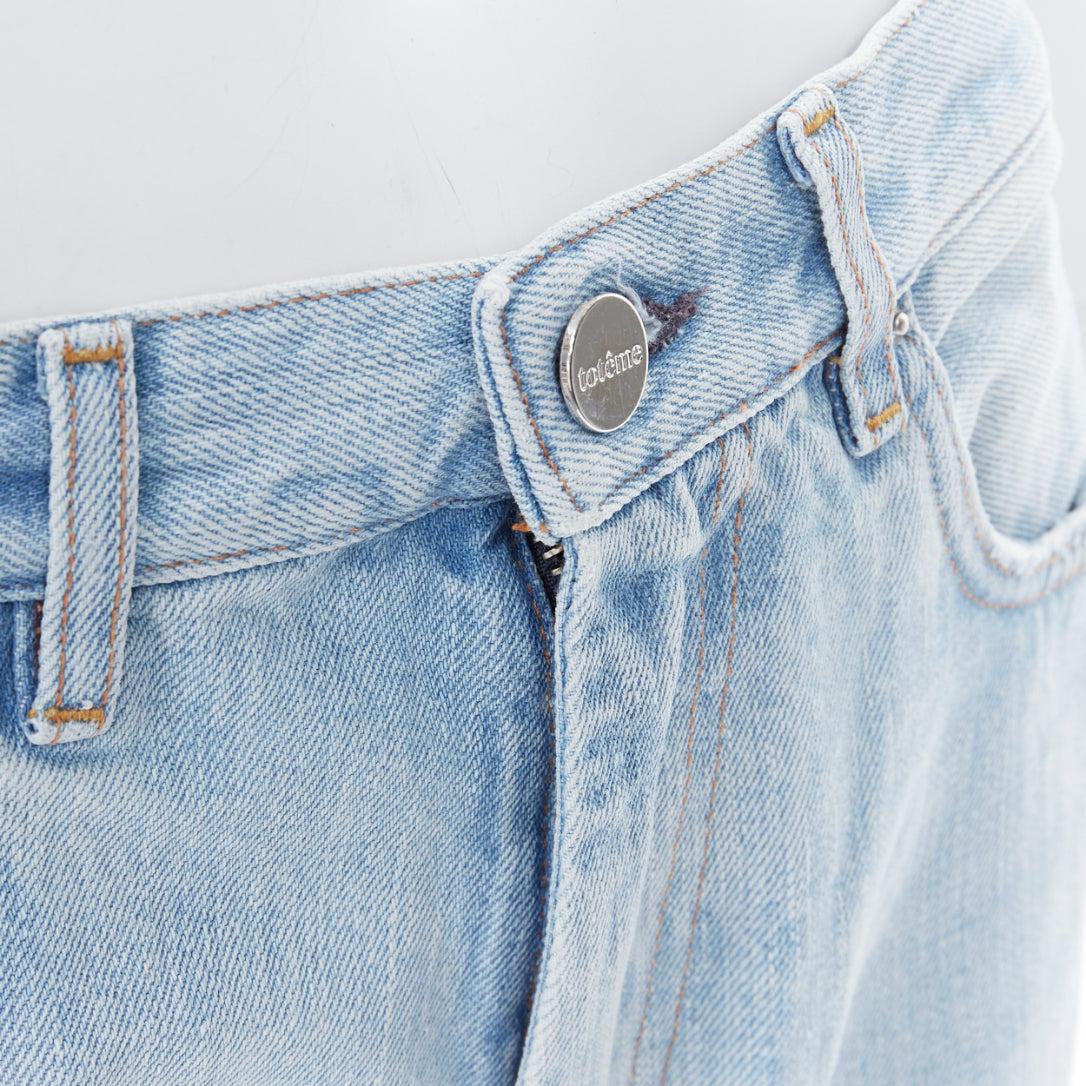 TOTEME Twisted Seam light blue washed denim asymmetric jeans 27