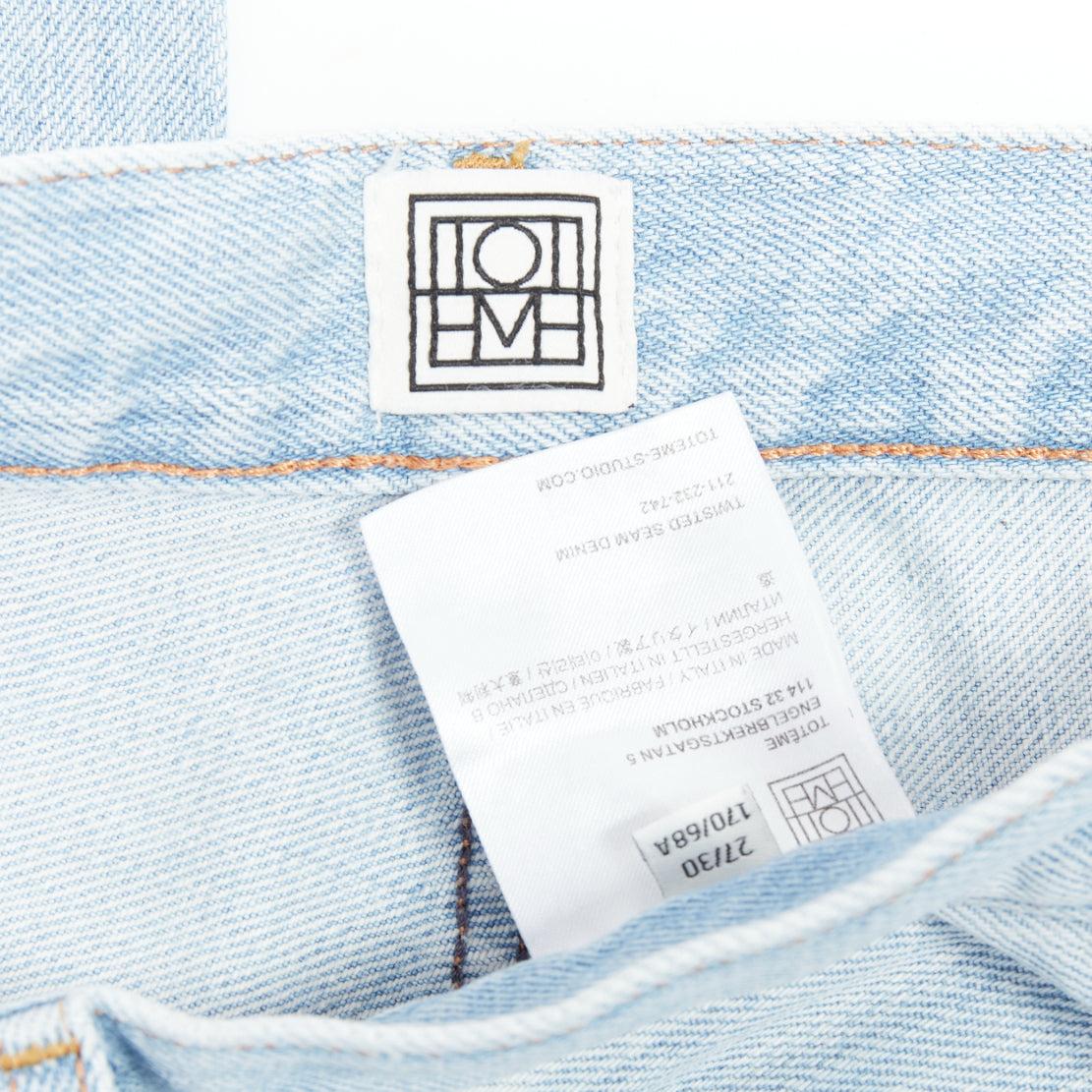TOTEME Twisted Seam light blue washed denim asymmetric jeans 27