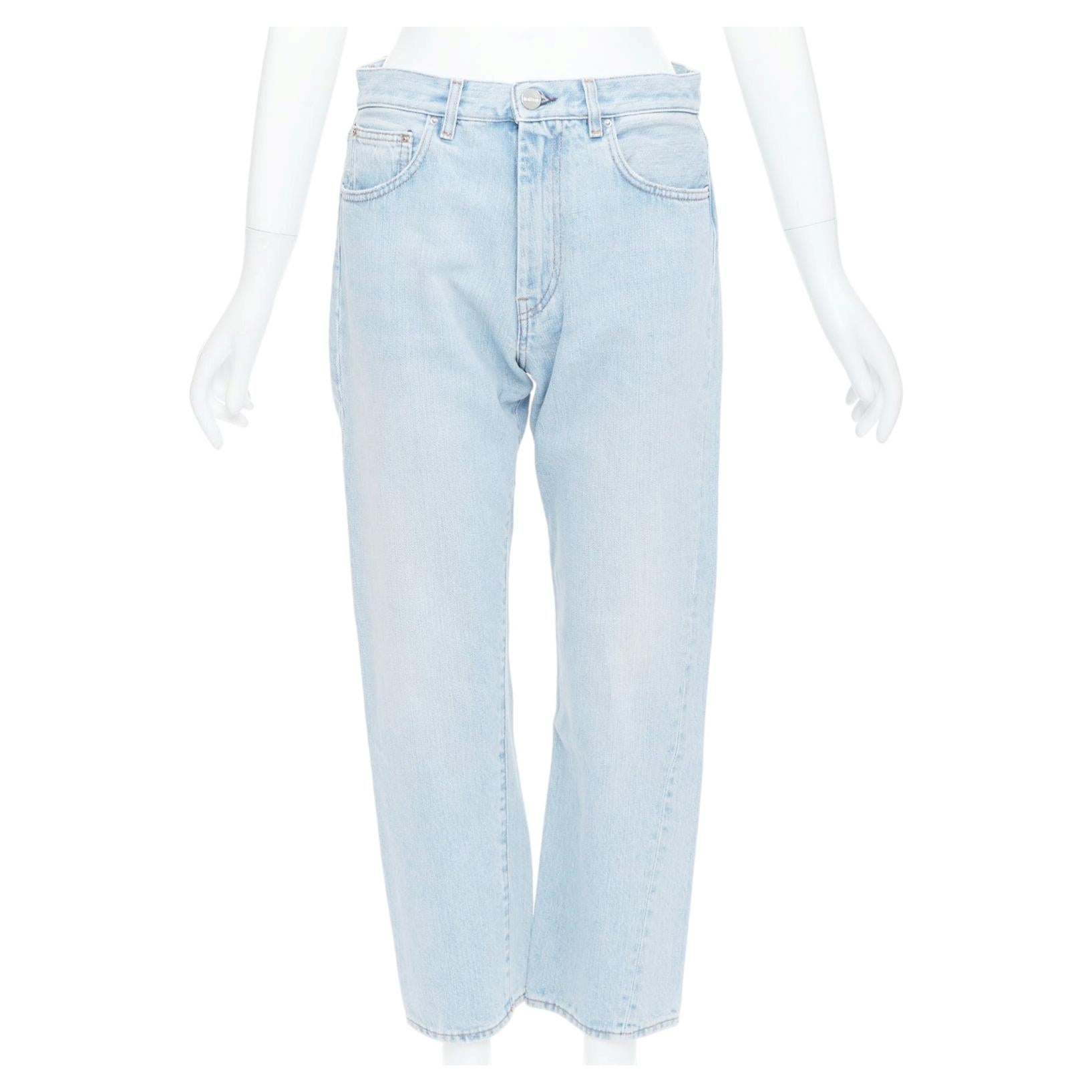 TOTEME Twisted Seam light blue washed denim asymmetric jeans 27" For Sale