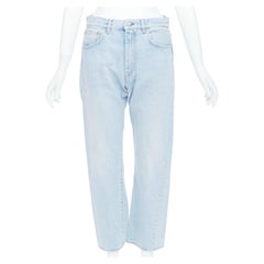 TOTEME Twisted Seam light blue washed denim asymmetric jeans 27"