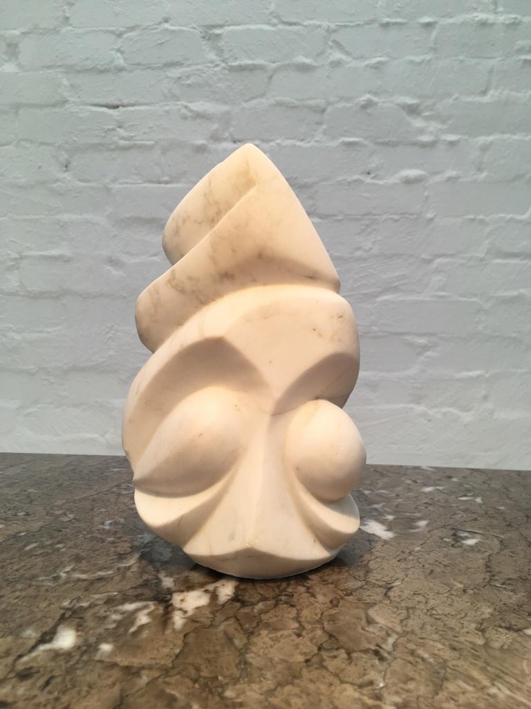 Another wonderful marble sculpture with an intriguing provenance. Unsigned. Part of a series by Paul Jencik, circa 1998-2001. 

This ‘totemic head’ sculpture is carved from a single block of marble in a snowy white. It’s the remaining head from a
