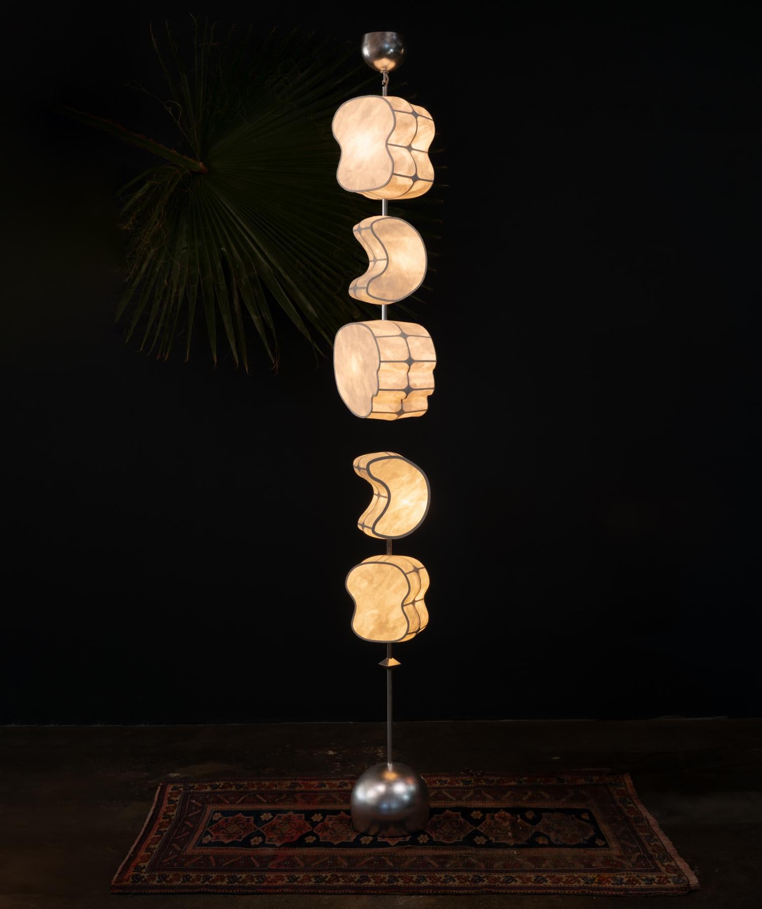 The Totemic Pendant 3(0) + Standing 2(1) is a combination of the Totemic standing lamp and pendant.

Totemic is Andrea Claire Studio’s latest lighting collection. Across cultures, totems serve as vessels of meaning, passed through generations,