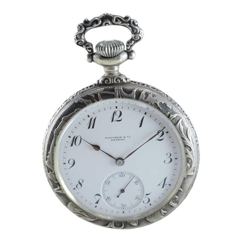 FACTORY / HOUSE: Touchon & Co. 
STYLE / REFERENCE: Open Faced 
METAL / MATERIAL: Silver
CIRCA / YEAR: 1900's 
DIMENSIONS / SIZE: Diameter 48mm
MOVEMENT / CALIBER: Manual Winding / 21 Jewels 
DIAL / HANDS: Kiln Fired Enamel with Breguet Style Arabic