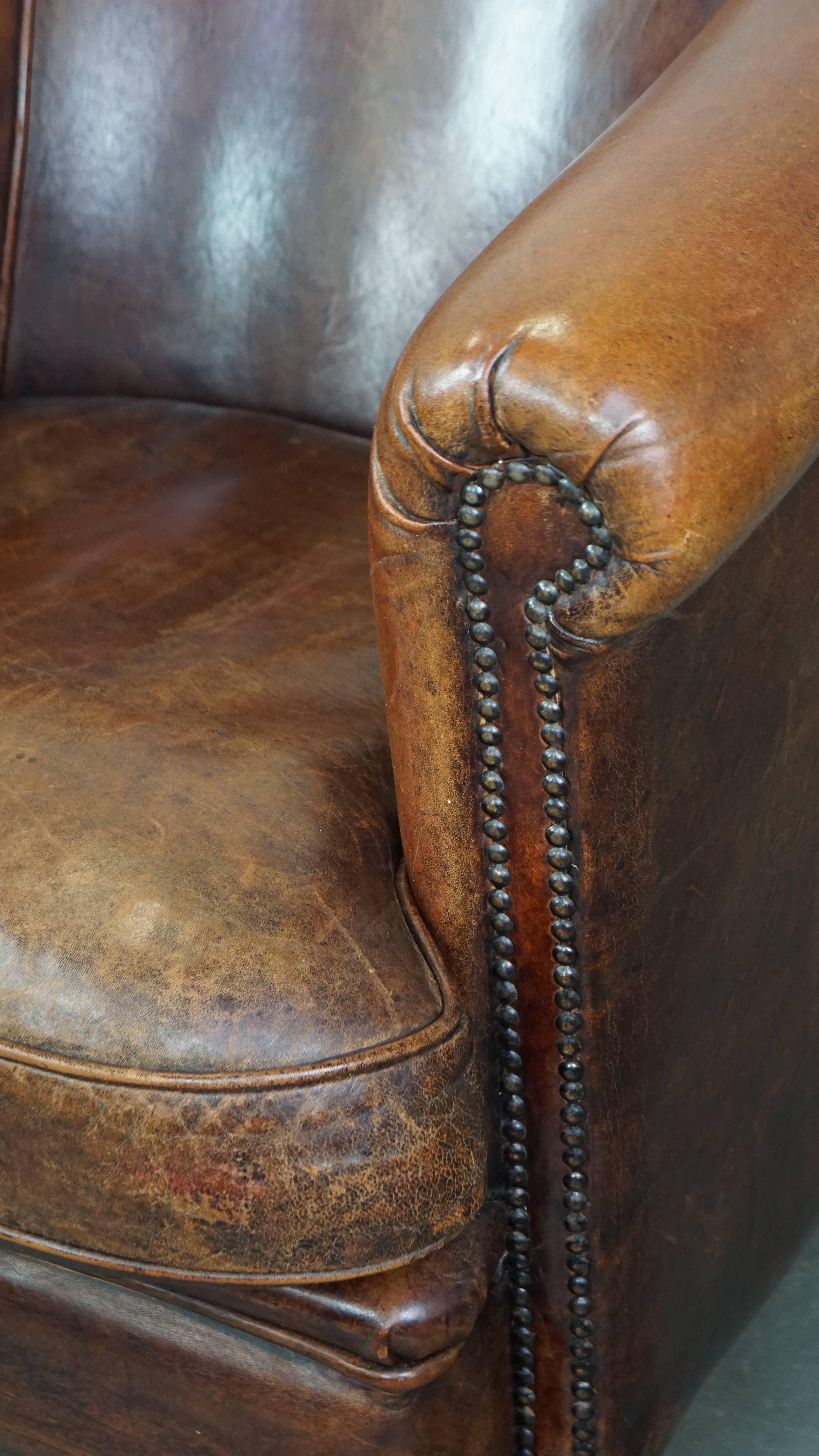 Tough, characterful, and comfortable cognac-colored sheepskin club armchair For Sale 4