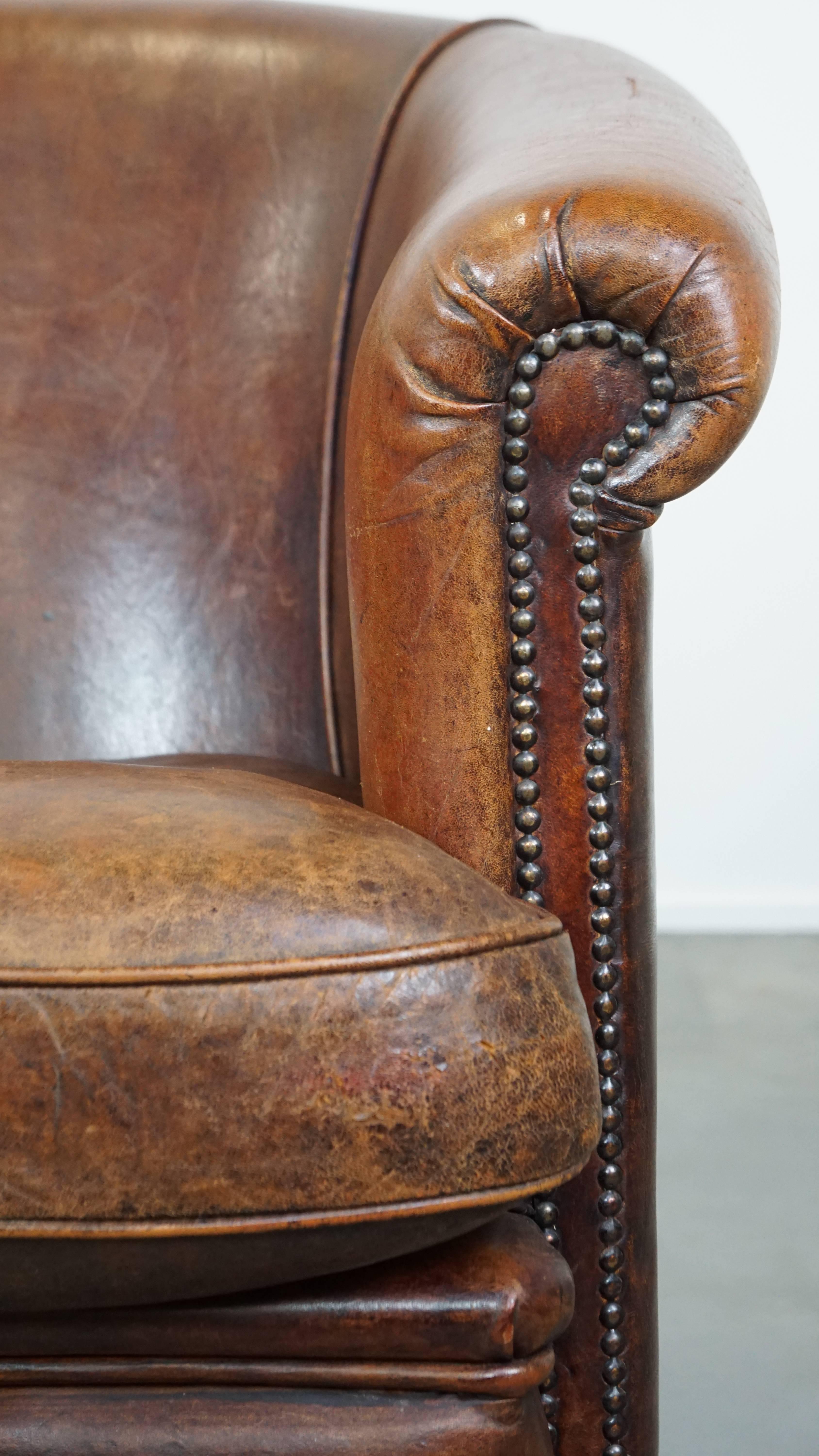 Tough, characterful, and comfortable cognac-colored sheepskin club armchair For Sale 5