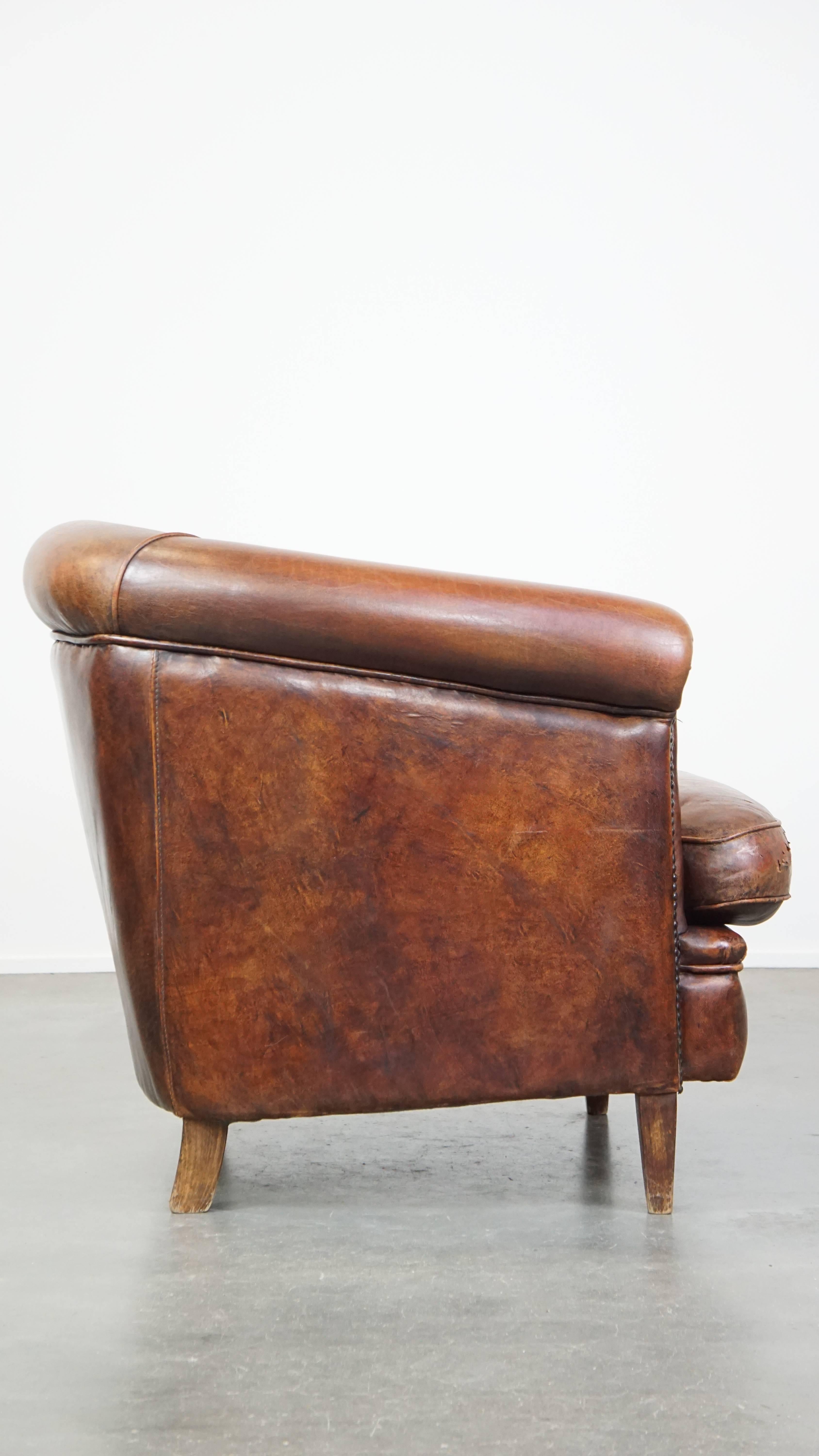 Hand-Crafted Tough, characterful, and comfortable cognac-colored sheepskin club armchair For Sale