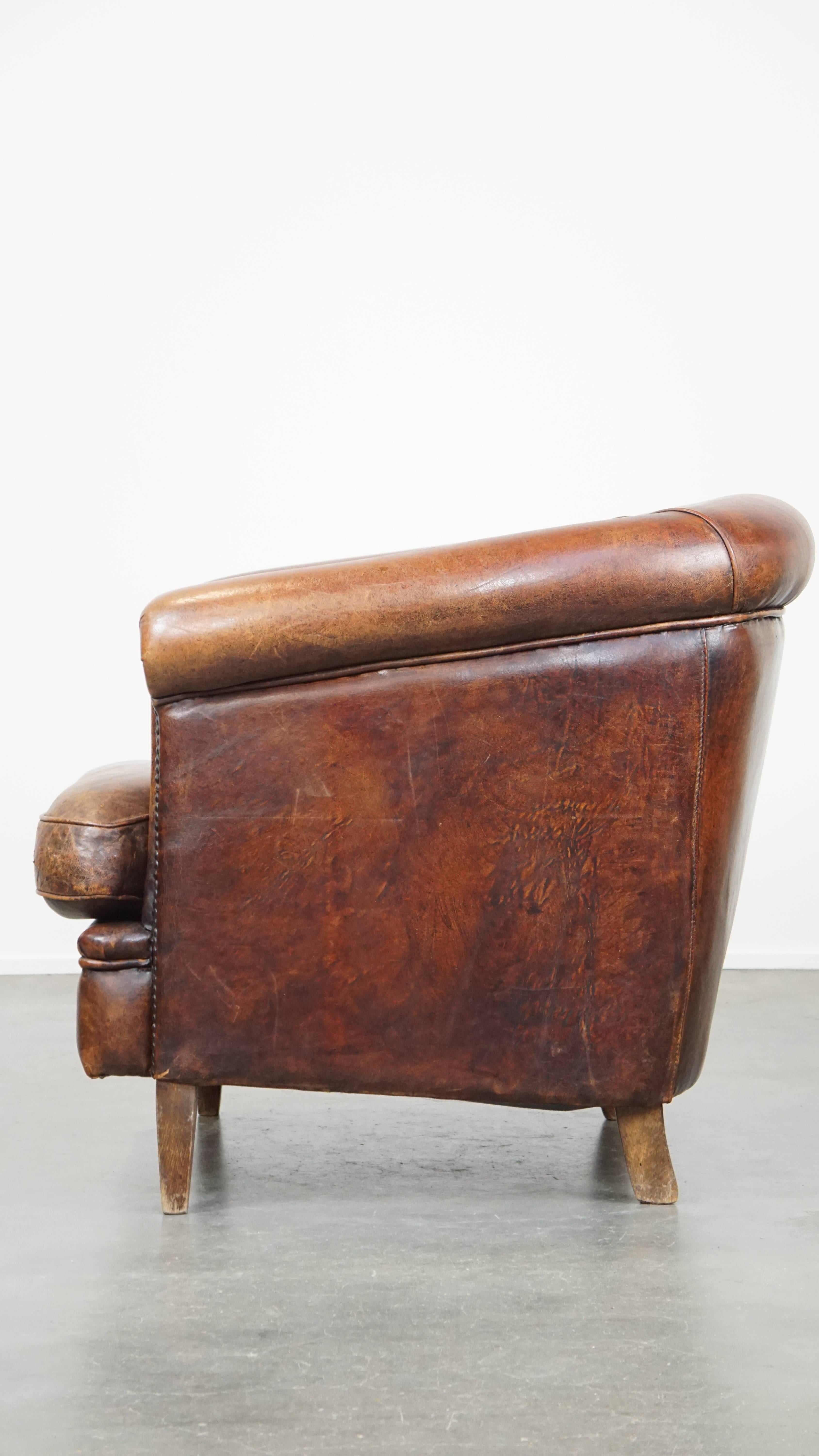 20th Century Tough, characterful, and comfortable cognac-colored sheepskin club armchair For Sale
