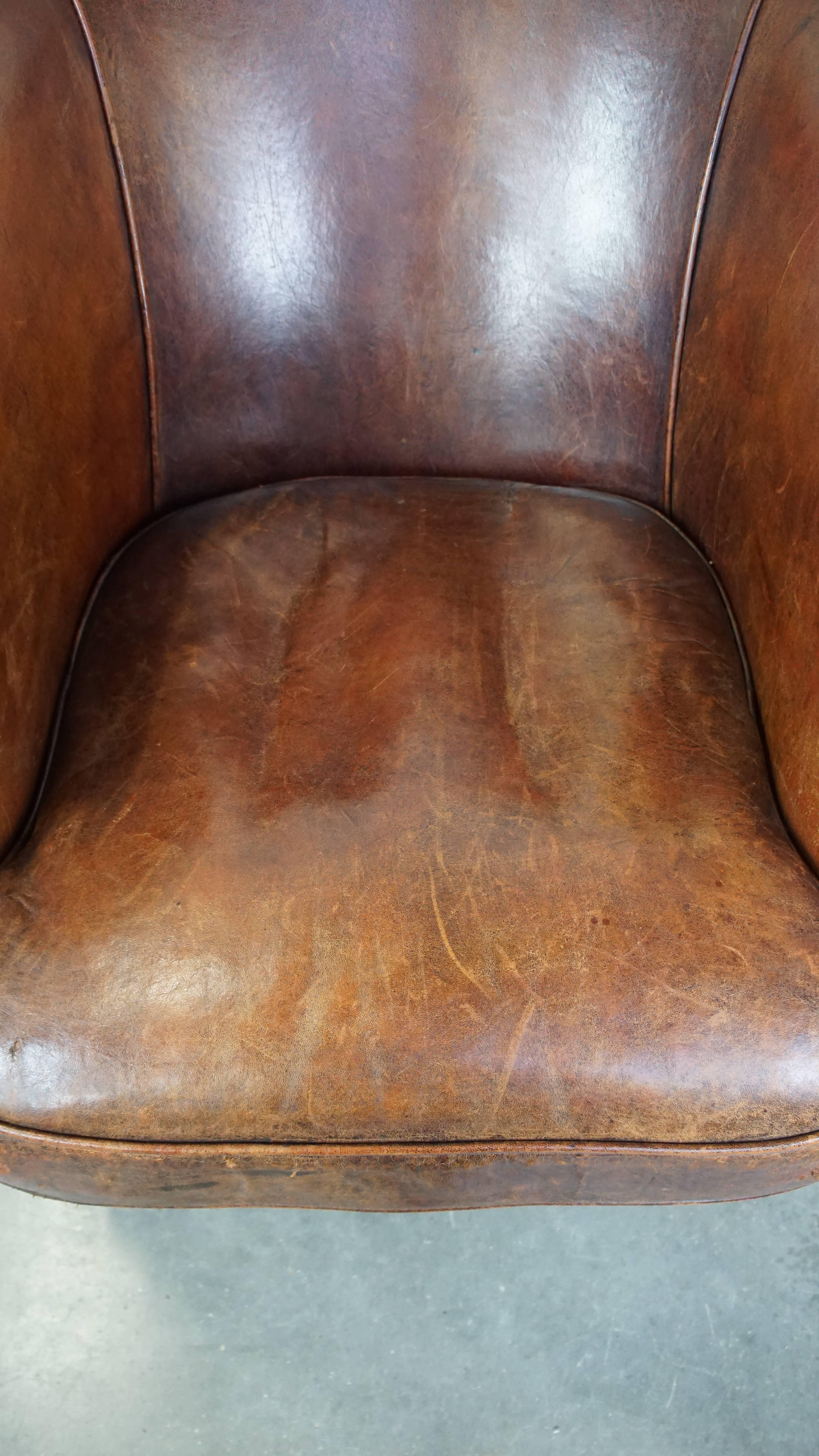 Leather Tough, characterful, and comfortable cognac-colored sheepskin club armchair For Sale